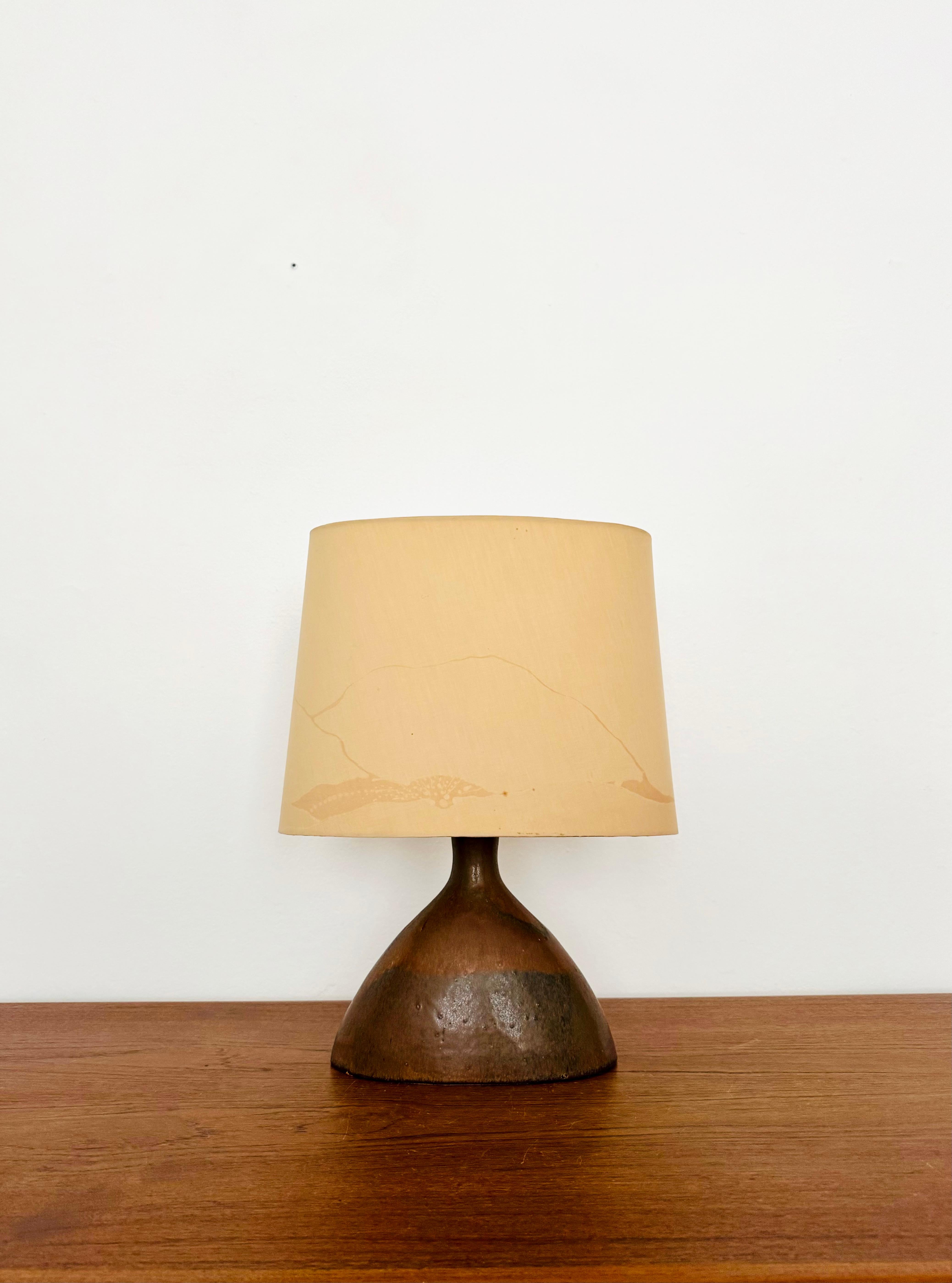 Wonderful ceramic table lamp from the 1960s.
Extremely high-quality workmanship and very beautiful design.
Exceptionally beautiful glaze.
A very cozy light is created.

Condition:

Very good vintage condition with minimal signs of wear.
A small chip