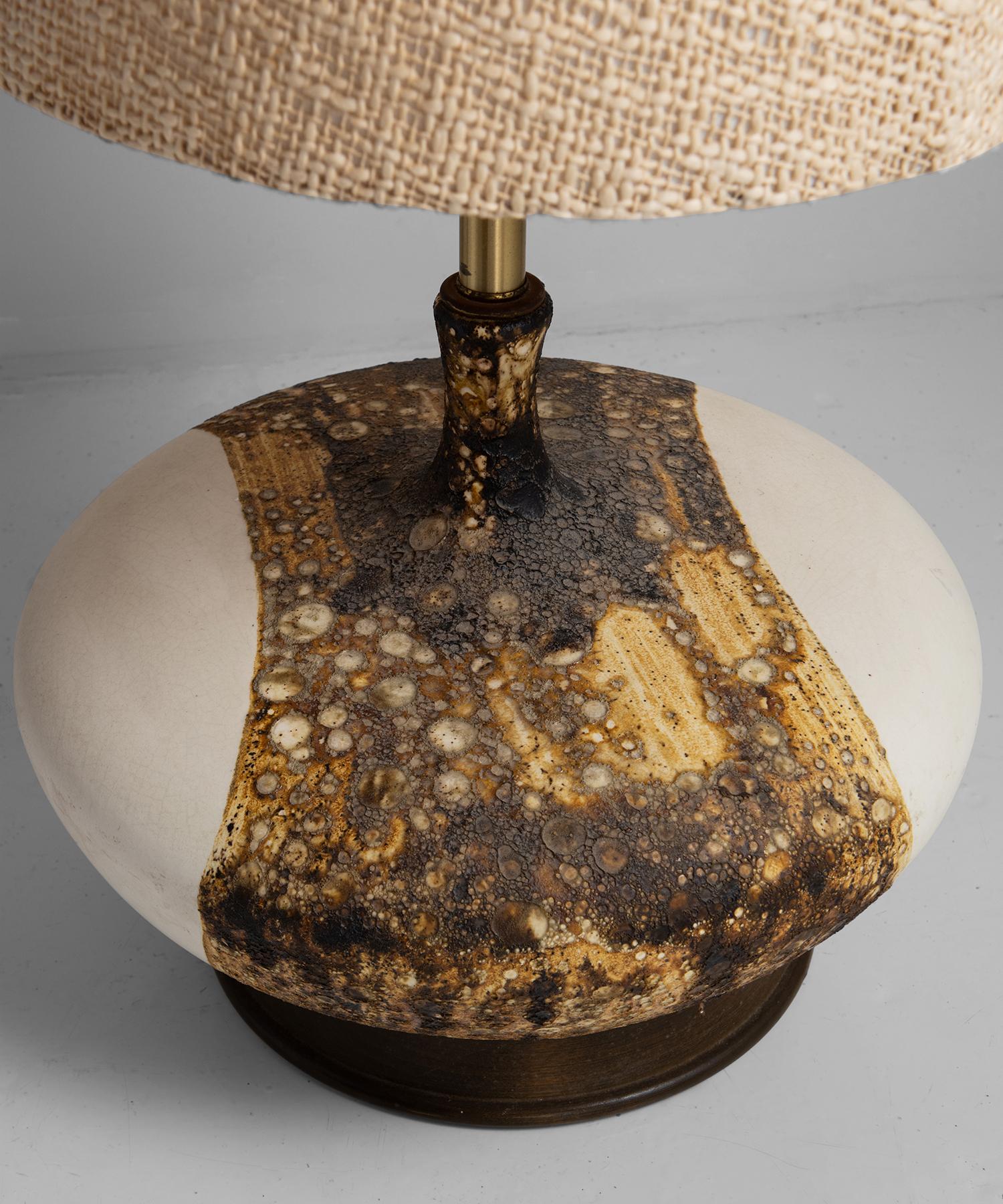 Monumental lamp with original cloth shade.