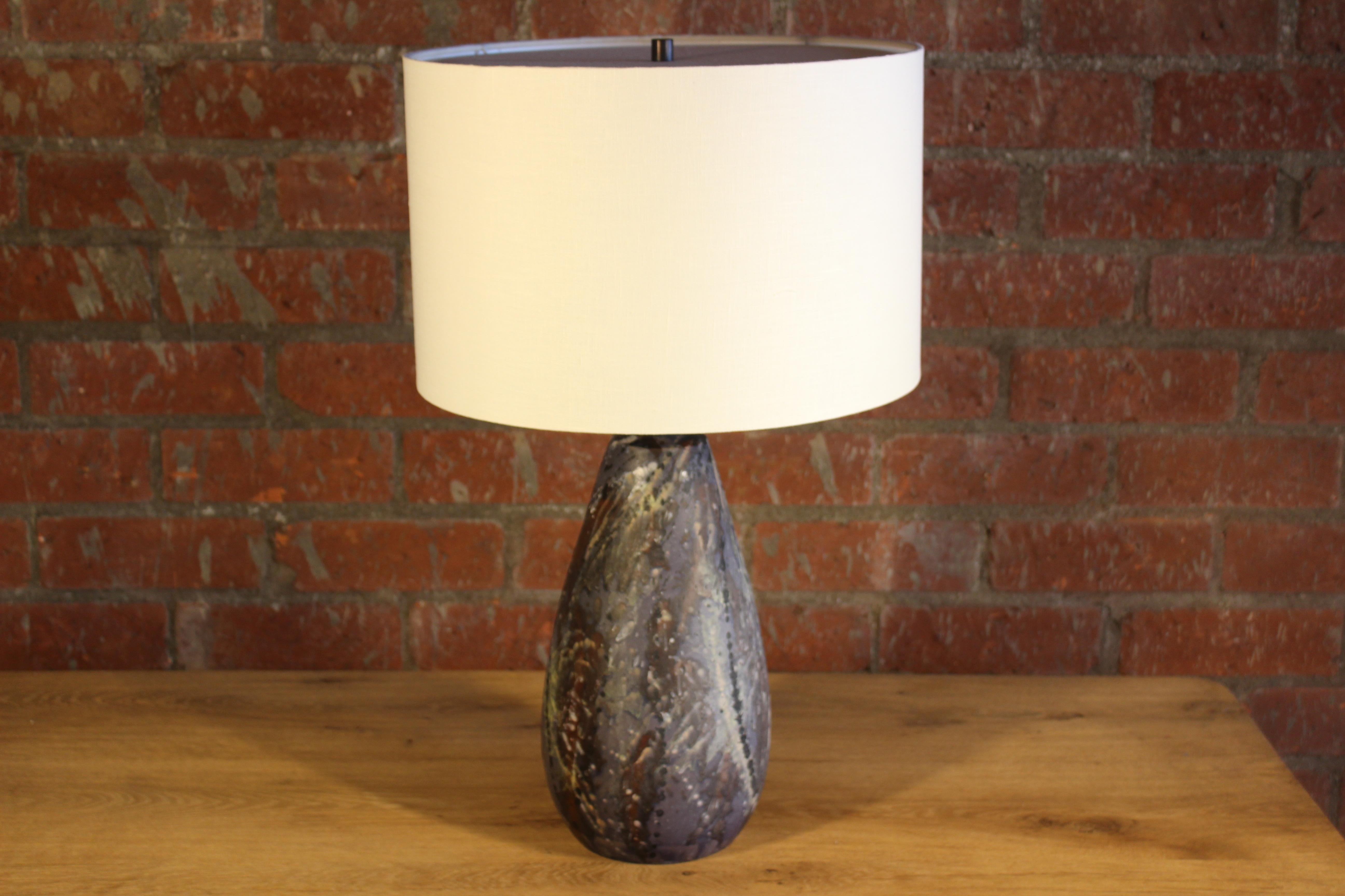 A vintage French ceramic lamp from the 1960s. Newly rewired and fitted with a custom made shade in linen. 28