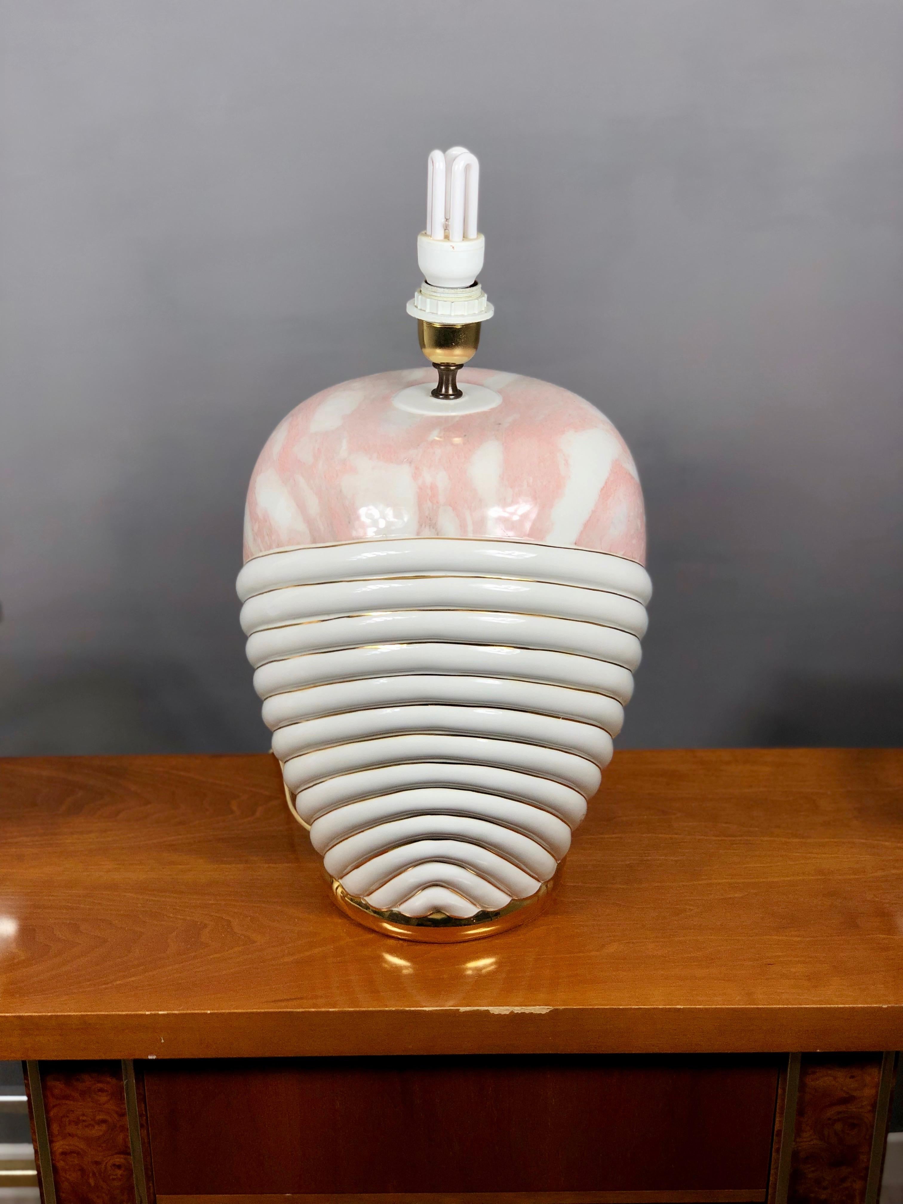 Big table lamp in white ceramic with pink stripes. 
Designed and executed by Paolo Traversi (signed), 1980s.
 