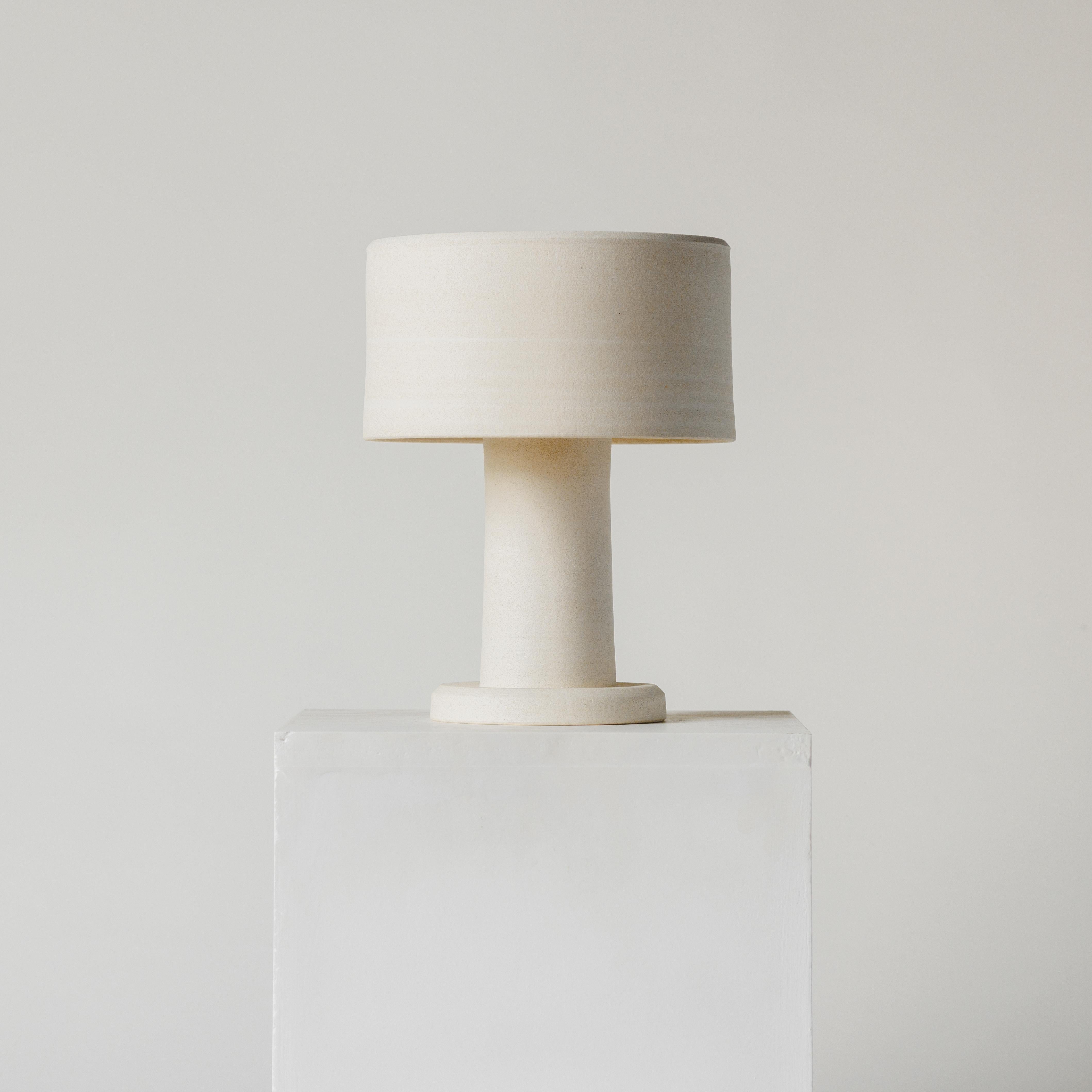 It starts off with 3kg of clay for both the top and bottom of the lamp. Thrown on the potters wheel they are left to dry overnight and trimmed, smoothed and fitted together the next day. It's during this process that the fit is adjusted and the