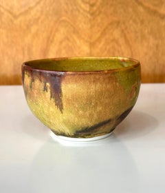 Ceramic Tea Bowl with Mottled Yellow Glaze by Toshiko Takaezu