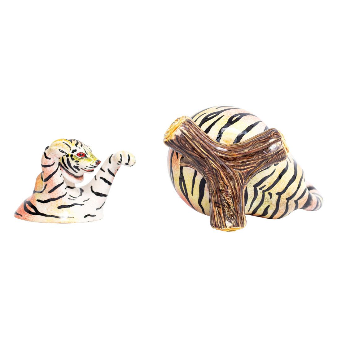 This ceramic tiger box from Love Art Ceramic is not just a piece of art; it's a symbol of strength, beauty, and craftsmanship. Handmade by talented artisans Sbusiso and Minenhle Nene in South Africa, it transcends cultural boundaries, making it a