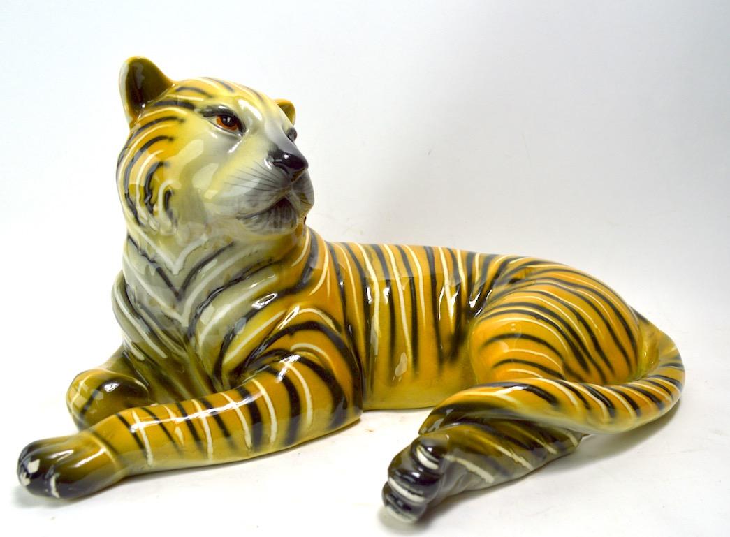 Chic midcentury Italian ceramic tiger, or tigress. Decorative and stylish, clean original condition, showing only minor glaze loss at feet, normal and consistent with age.