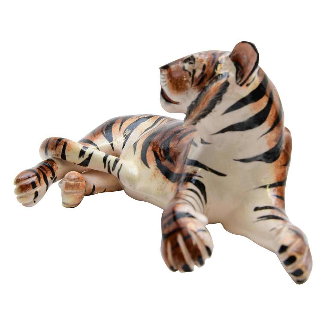 Discover the Ceramic Tiger Sculpture from Imvelo Natural Art, a breathtaking representation of wildlife artistry from South Africa. Hand-sculpted by Bernard and hand-painted by Palesa, this sculpture stands 5 inches high, 9 inches in length, and 4