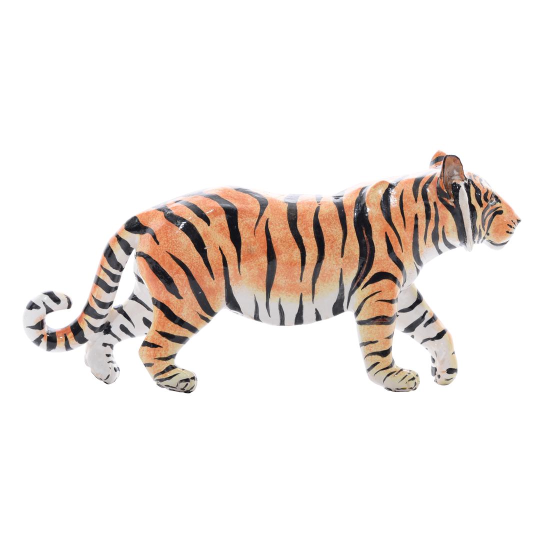 The tiger ceramic sculpture is a stunning piece, distinguished by its unique walking pose and exquisite craftsmanship. Hand-sculpted by Bernard and meticulously hand-painted by Gabriel at Imvelo Natural Art in South Africa, this sculpture stands out
