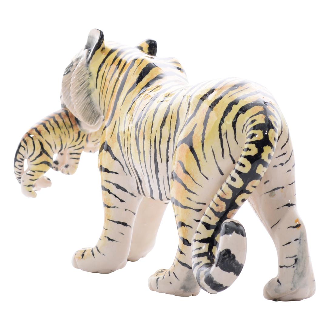 Discover the Ceramic Tiger Sculpture from Imvelo Natural Art, a breathtaking representation of wildlife artistry from South Africa. Hand-sculpted by Bernard and hand-painted by Palesa, this sculpture stands 5 inches high, 9 inches in length, and 4