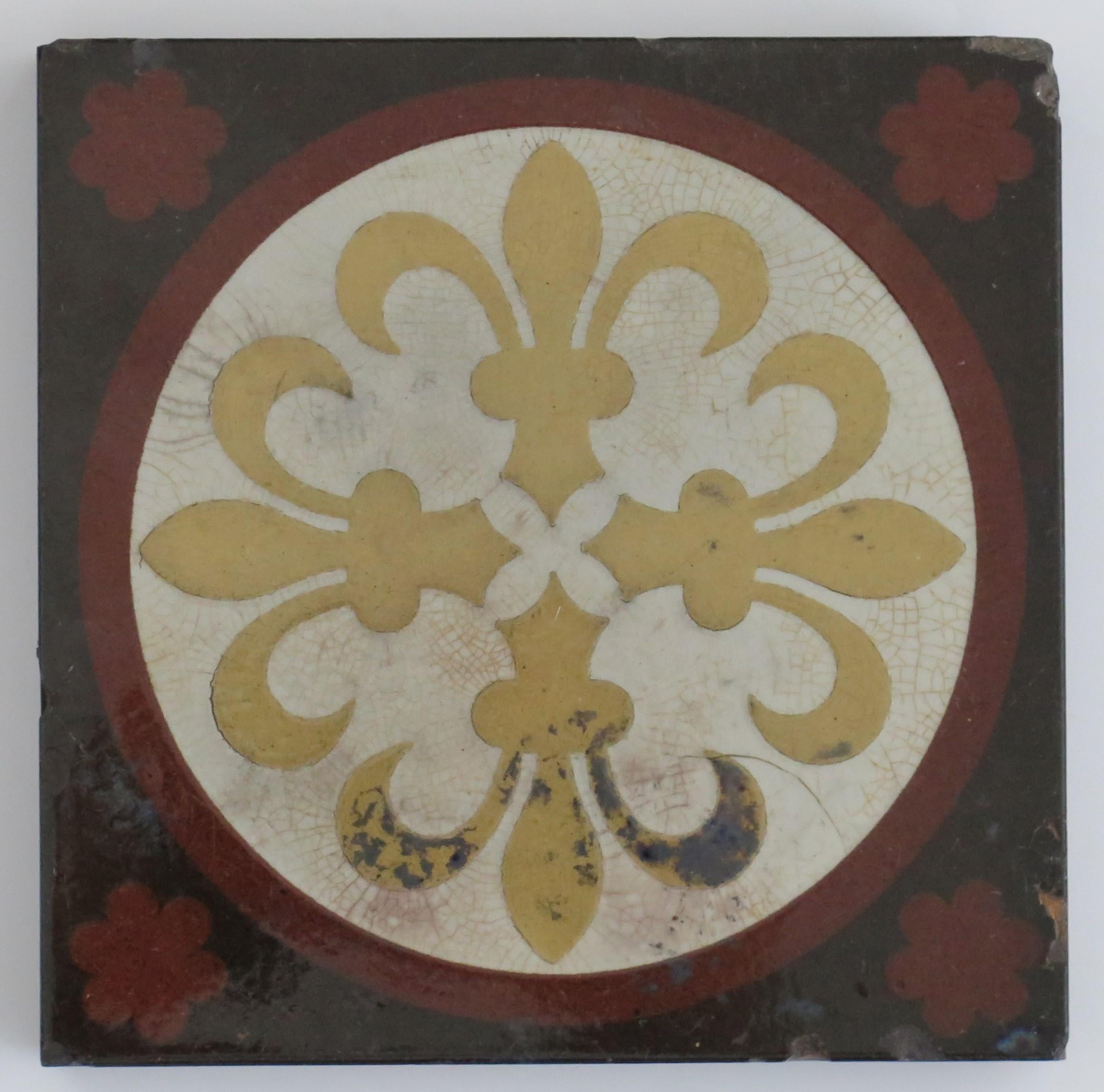 This is a very decorative encaustic ceramic tile made by William Godwin, dating to the 19th century, circa 1870. 

This tile may have been originally made as a floor tile. 

Dimensions; 6 x 6 x 0.85 inches.

This large tile is a beautiful
