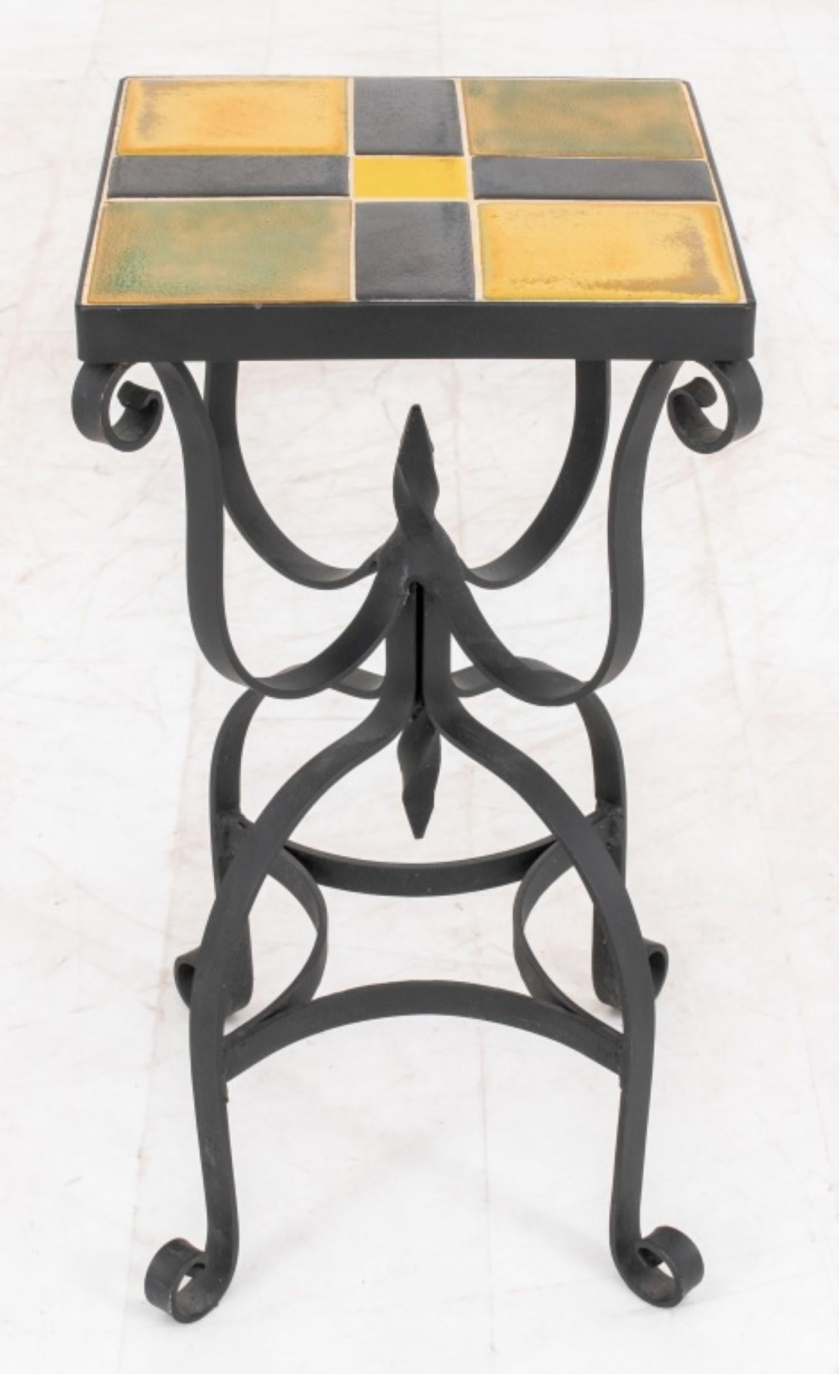 The set of two ceramic tile top iron accent tables includes a larger one,

Measuring approximately 22 inches in height, 11 inches in width, and 11 inches in depth. The tables feature a checkerboard pattern and scrolling design, making them suitable