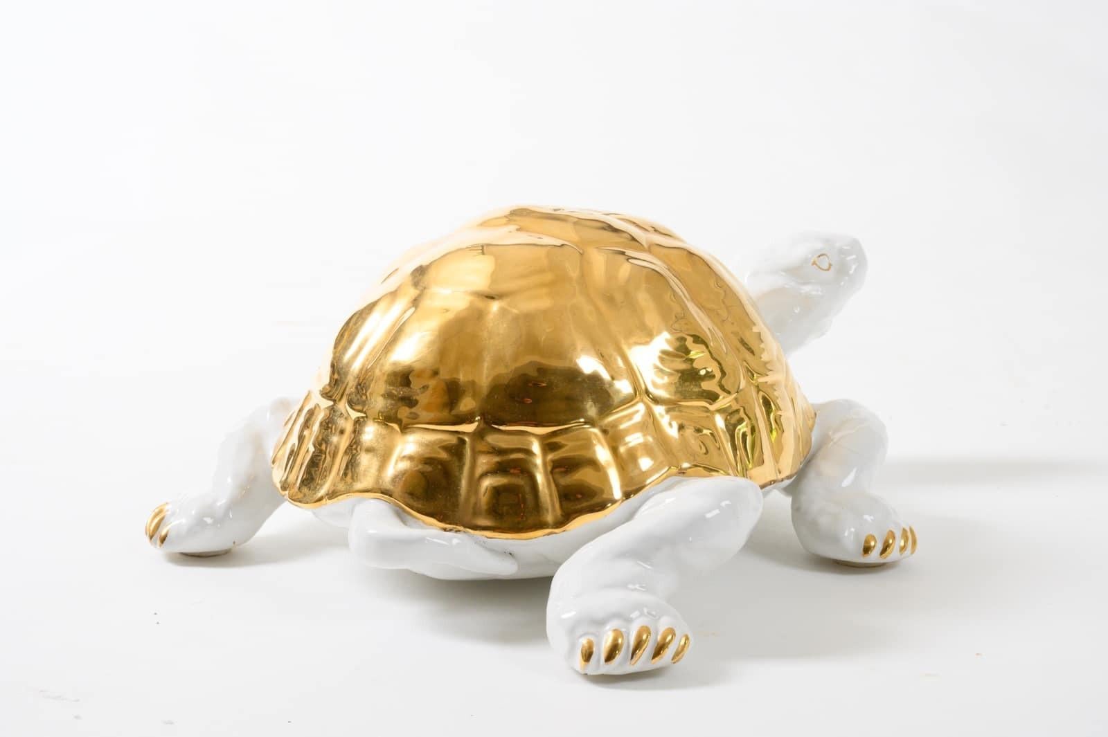 Cute, chic white ceramic tortoise with gold detailing by Ronzan. Signed to the underside “Ronzan” ” Made in Italy” & the number 1640, Italy, circa 1970.