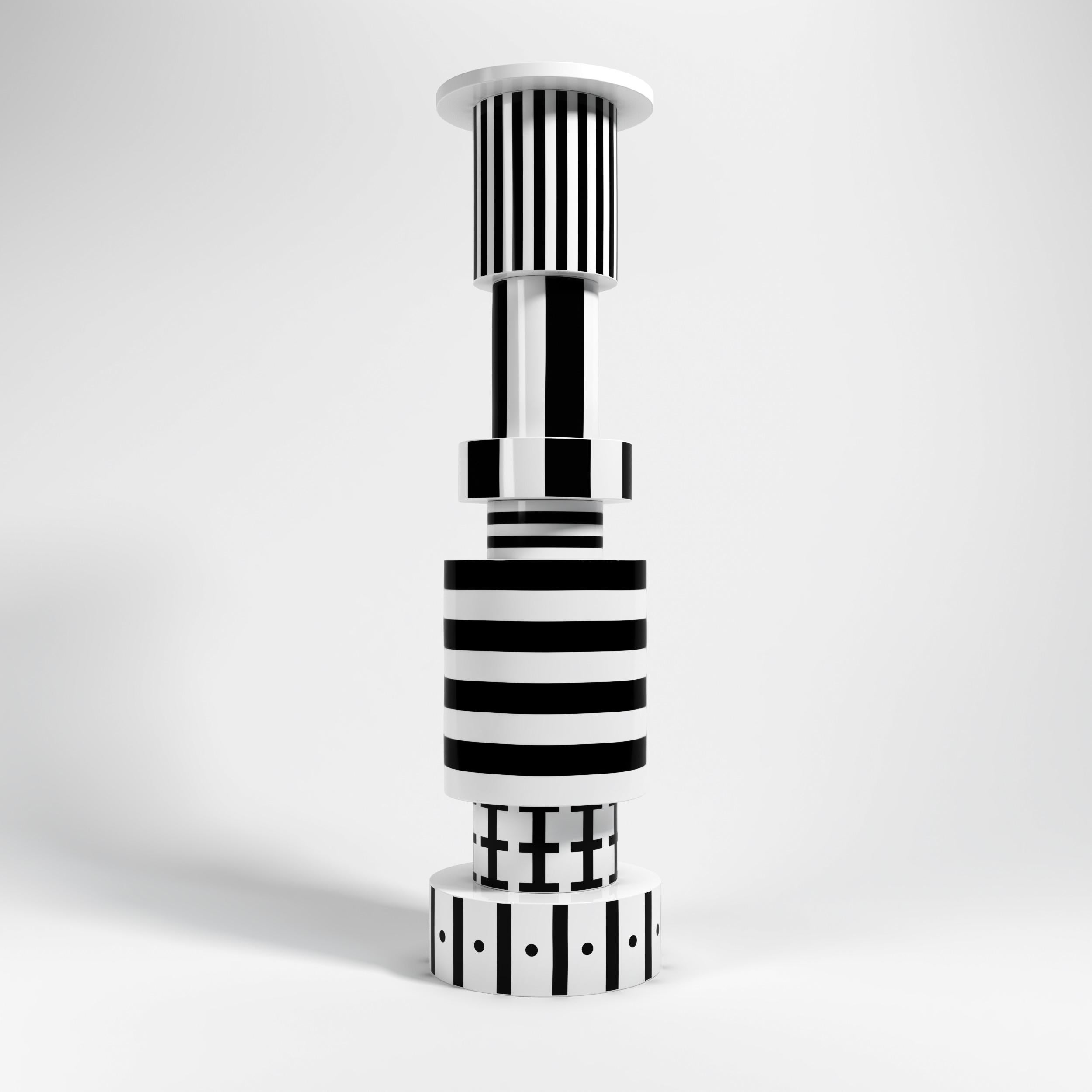 Scultura in ceramica della collezione Totem disegnata da Alessandro Guerriero e prodotta da Superego Editions. Prototipo.

Biografia
Nel 1976 Alessandro e Adriana Guerriero fondano Alchimia, il primo esempio di produzione di designer a Milano. Nel