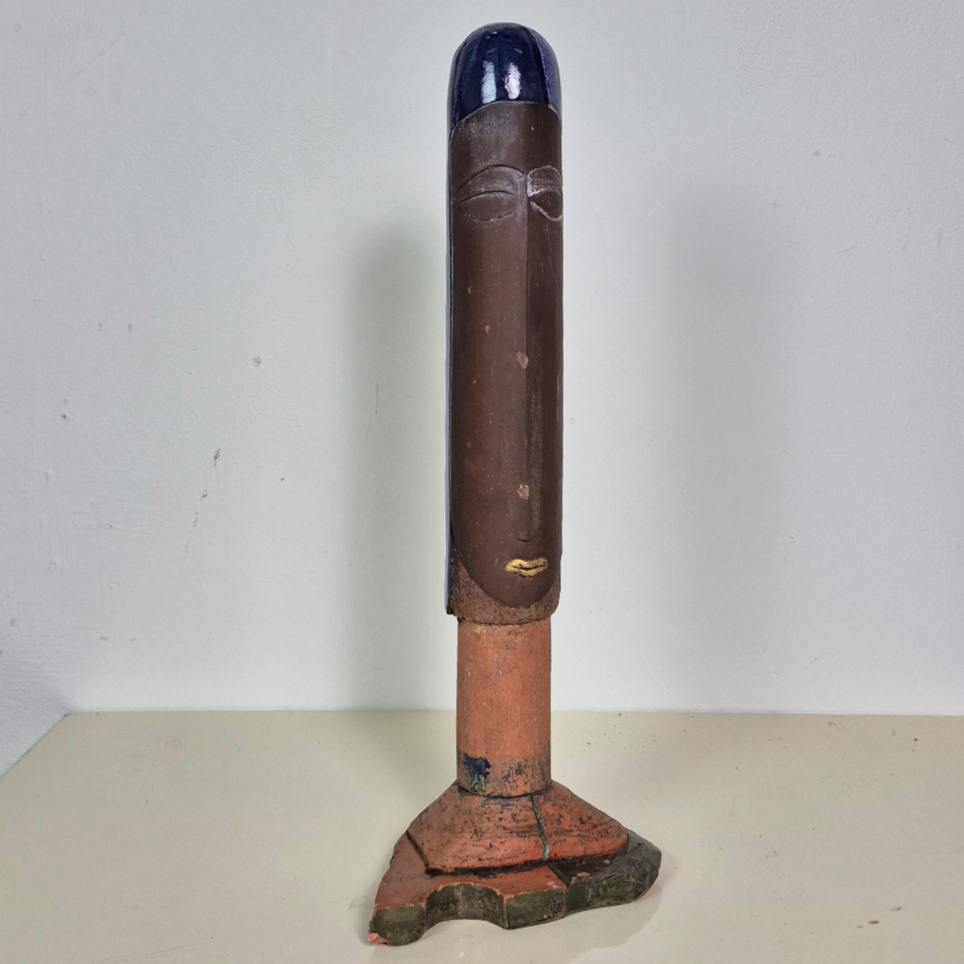 Hand sculpted ceramic statue. Made by German artist Dieter Eichelmann in the 1980s. 
Totem or phallus style abstract figure sculpted from terracotta clay with Polychrome glazing. 

The statue came from the personal collection of the artist himself.