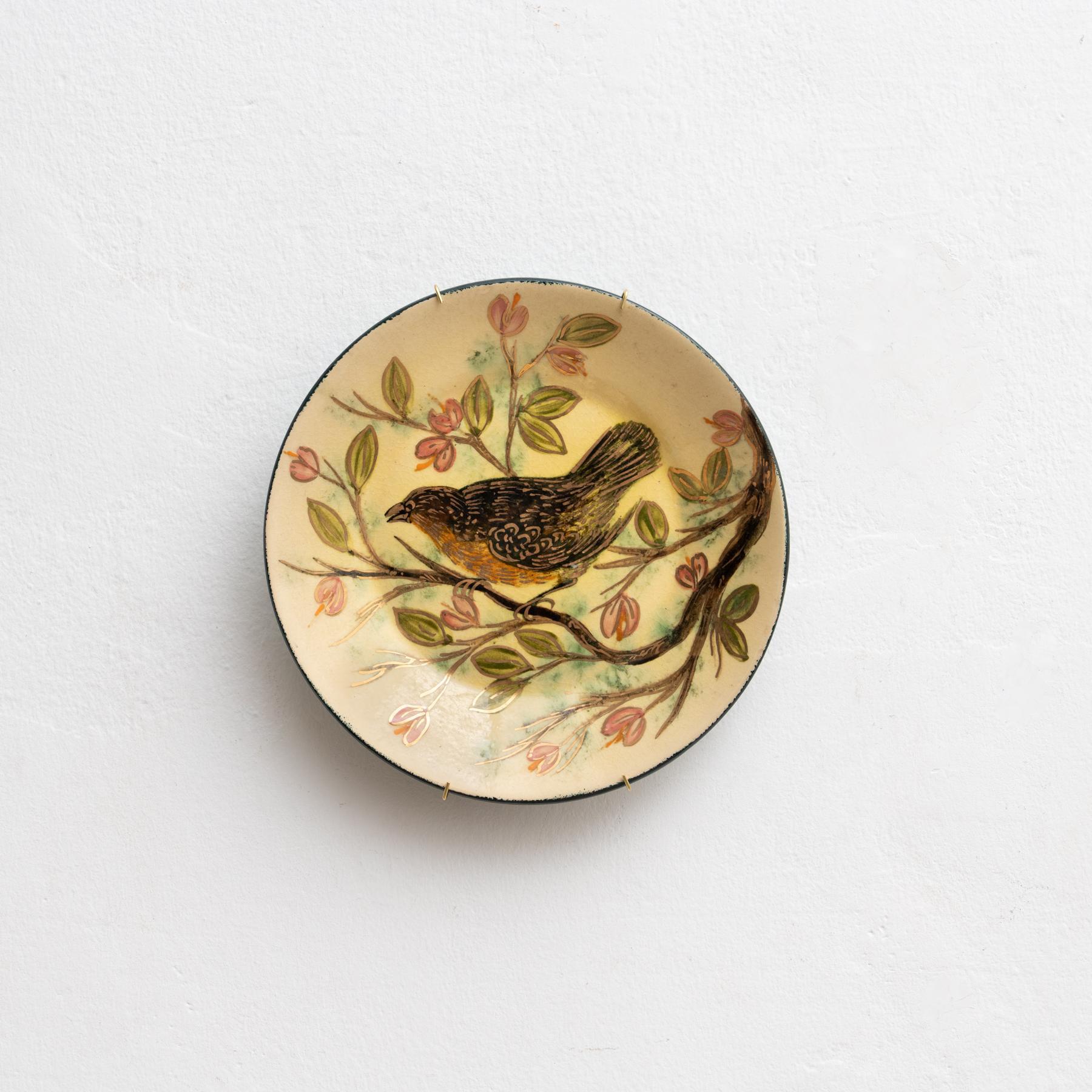 Assiette en céramique peinte à la main par l'artiste catalan Diaz COSTA, vers 1960.    En état d'origine, avec de légères usures dues à l'âge et à l'utilisation, préservant une belle patine.    Marqué au dos.