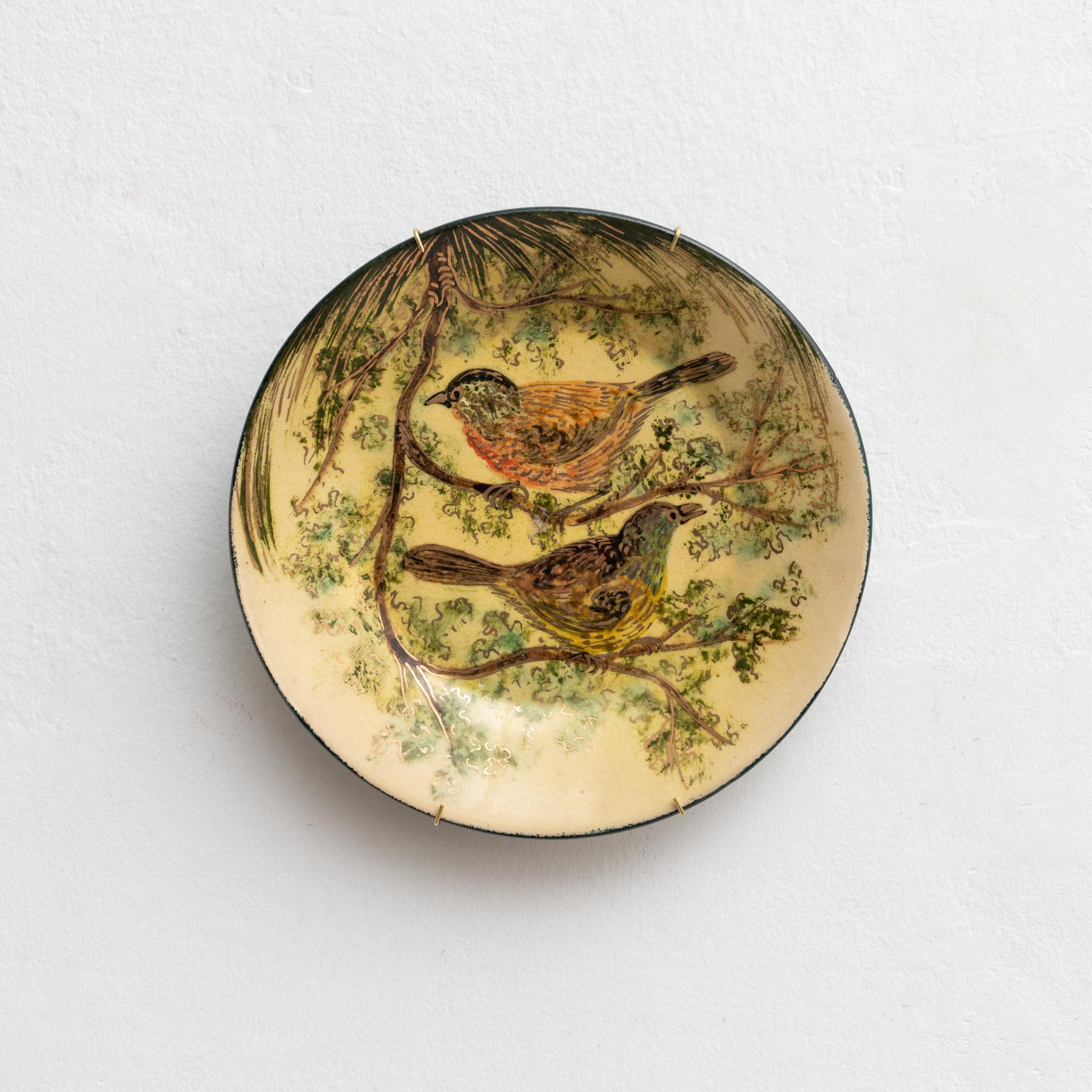 Ceramic hand painted plate artwork by Catalan artist Diaz Costa, circa 1960.    In original condition, with minor wear consistent of age and use, preserving a beautiful patina.    Marked in the back.