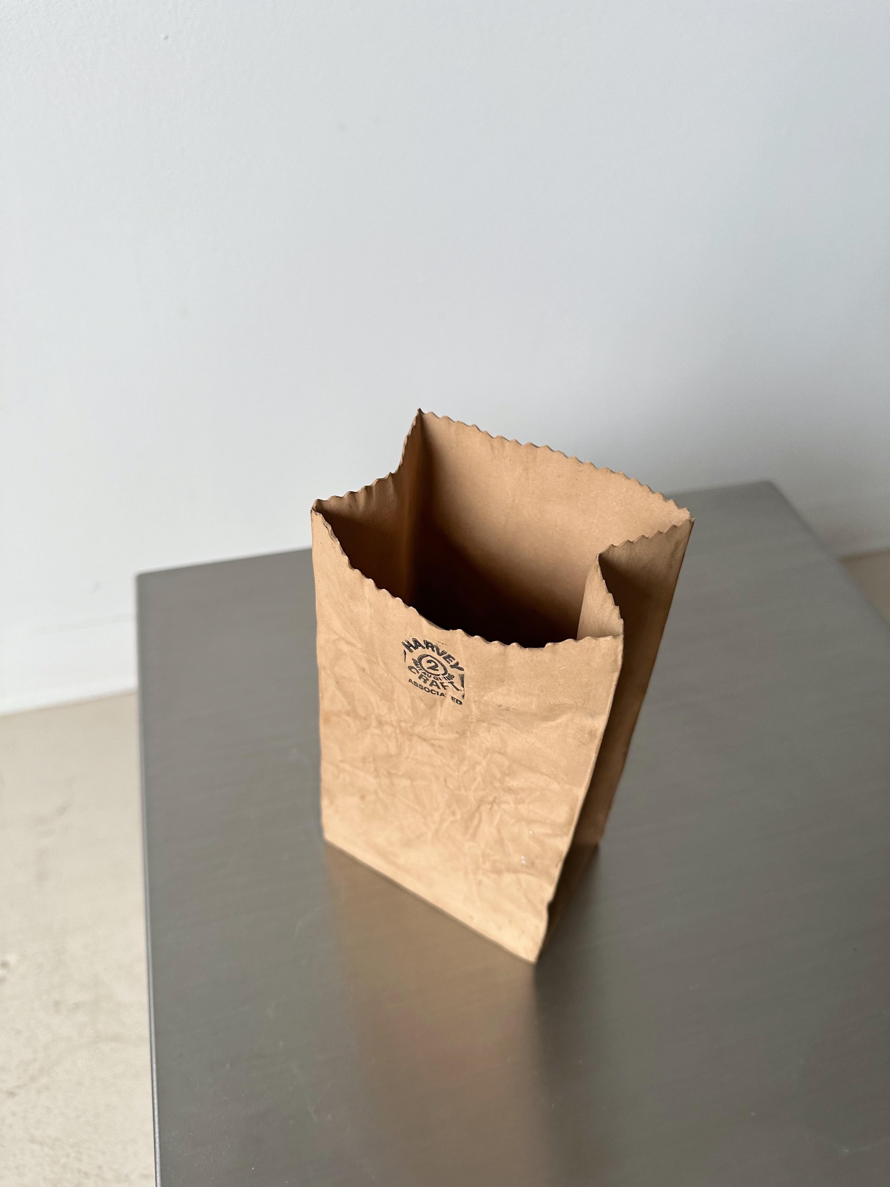 Ceramic Trompe L-oeil Brown Paper Bag Vase by Michael Harvey, 80's

Made in Canada

//  

Dimensions: 
4”W x 2.5