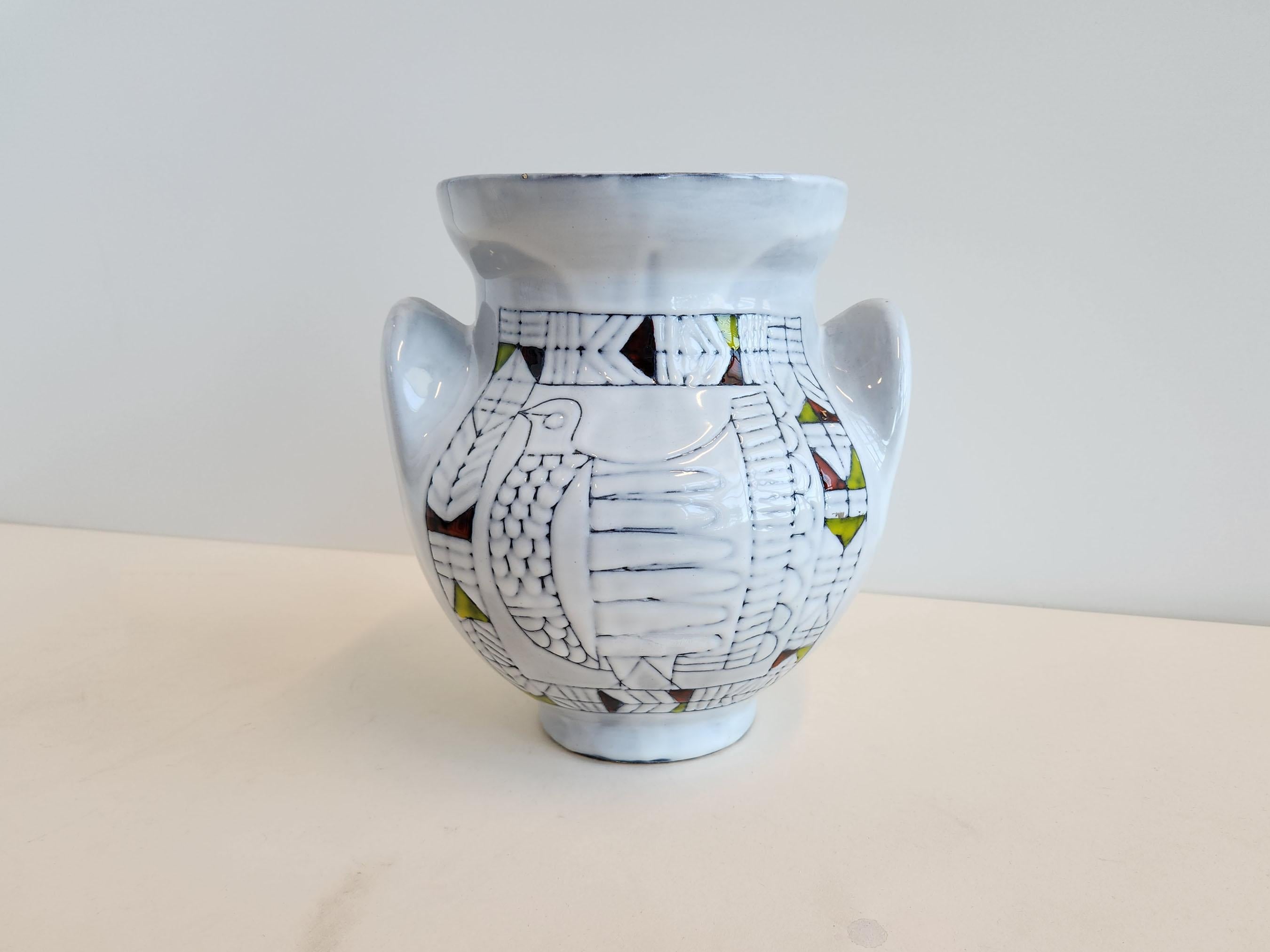Vintage ceramic vase with abstract design by Roger Capron.

Vallauris, France

Roger Capron was in influential French ceramicist, known for his tiled tables and his use of recurring motifs such as stylized branches and geometrical suns. He was born