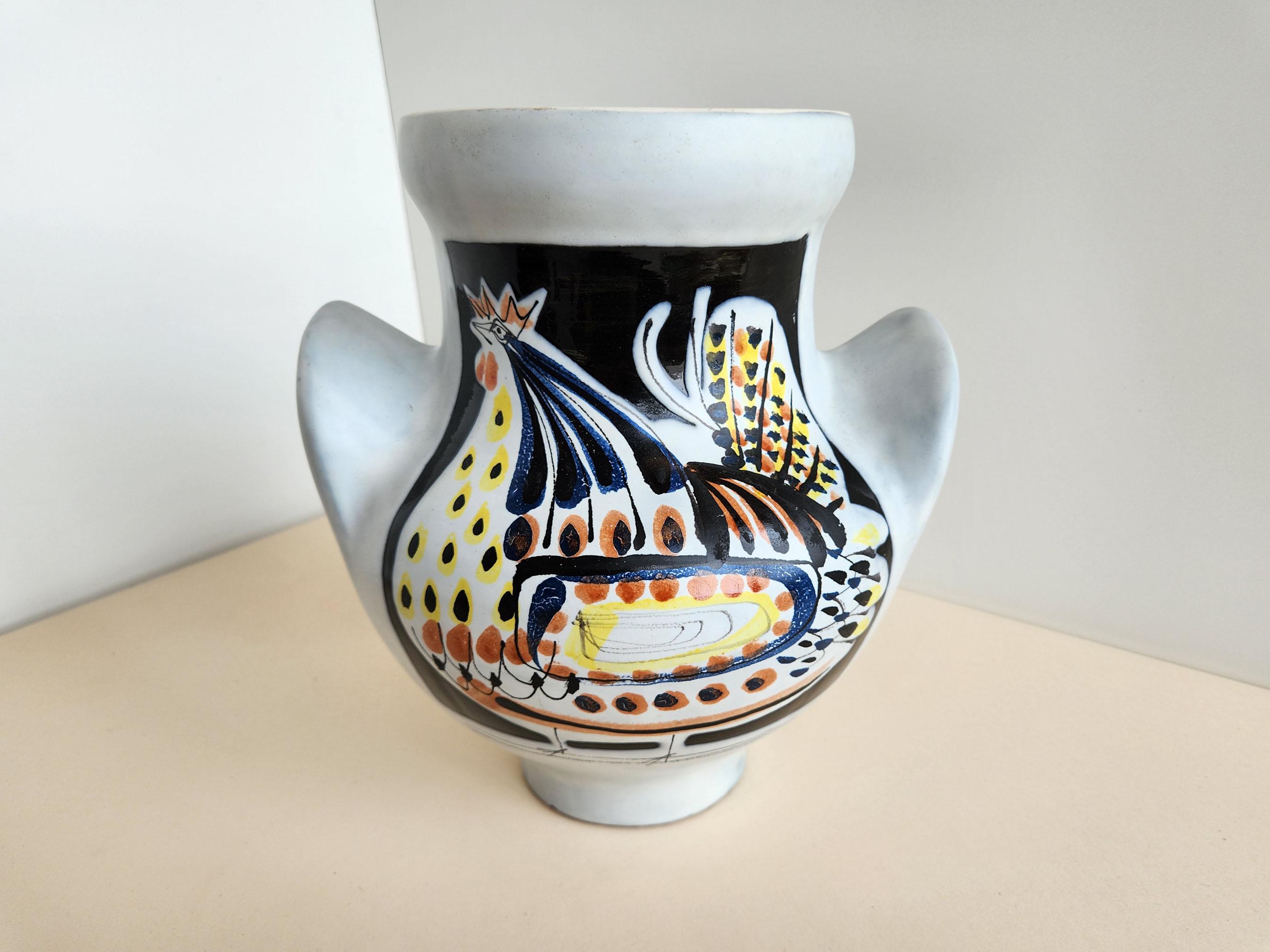Vintage ceramic vase with rooster by Roger Capron

Vallauris, France.

Roger Capron was in influential French ceramicist, known for his tiled tables and his use of recurring motifs such as stylized branches and geometrical suns. He was born in
