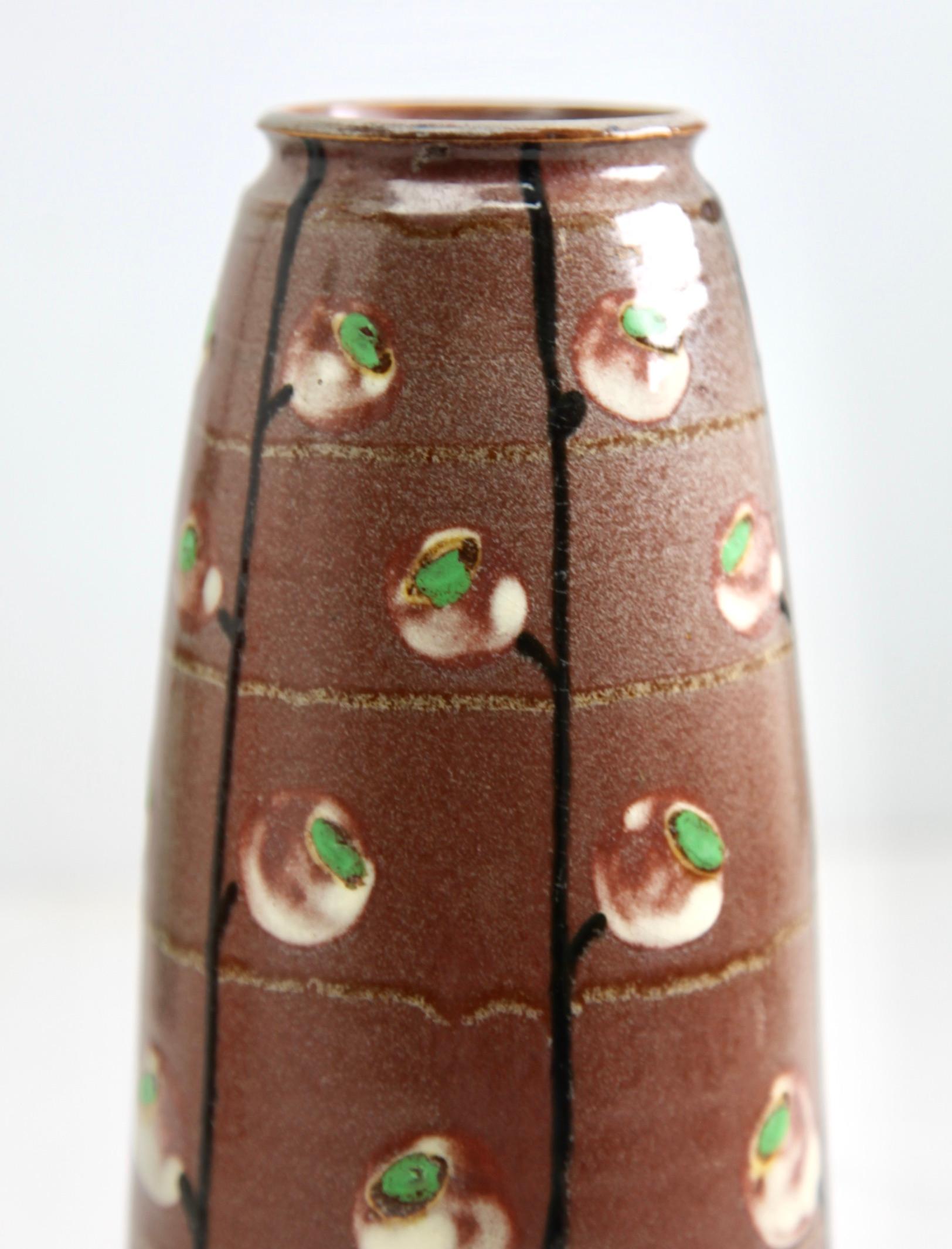 French ceramic vase, Alsace France, circa 1930.
Handcrafted and glazed earthenware with horizontal ribs.
Beautiful glaze in brown and green tints.
Perfect condition.

We specialise in Art Nouveau, Art Deco and Vintage