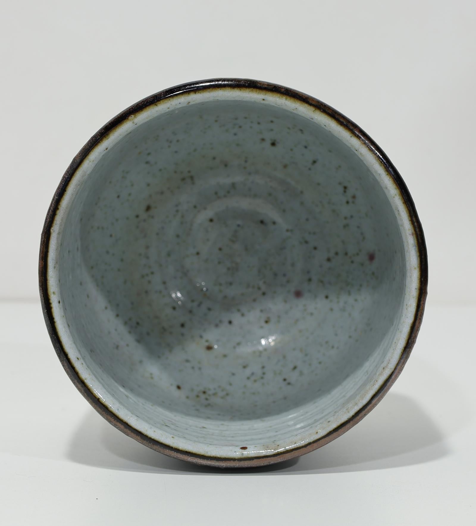 A potter and painter, Albert Green (1914 - 1994) earned an international reputation for his ceramics, stoneware, and canvases. A graduate of the University of Pennsylvania, he studied painting at the Art Students League in New York City, supporting