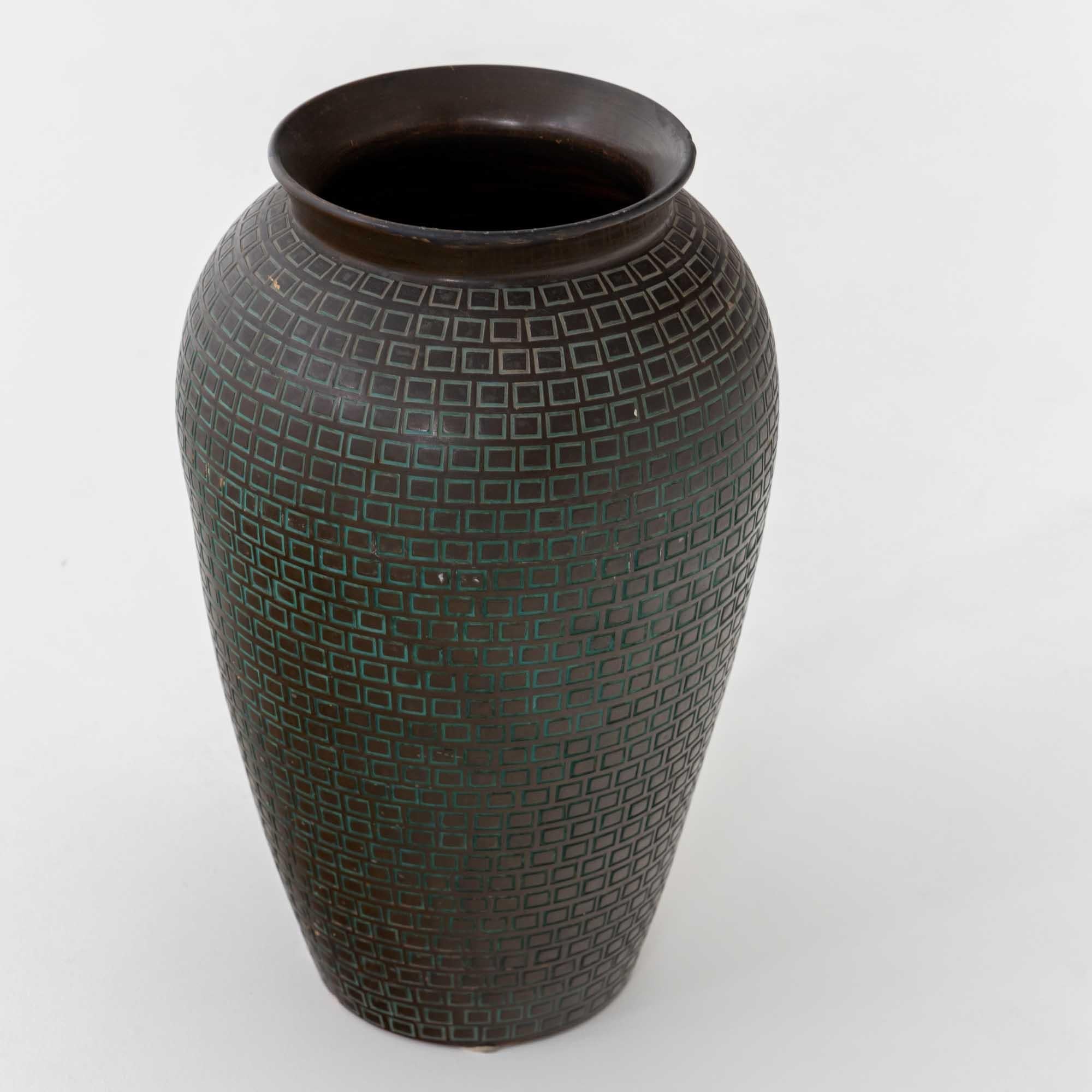 Large ceramic vase with conical wall decorated with small rectangles whose notches are coloured in turquoise. Signed Batignani Italy on the bottom.