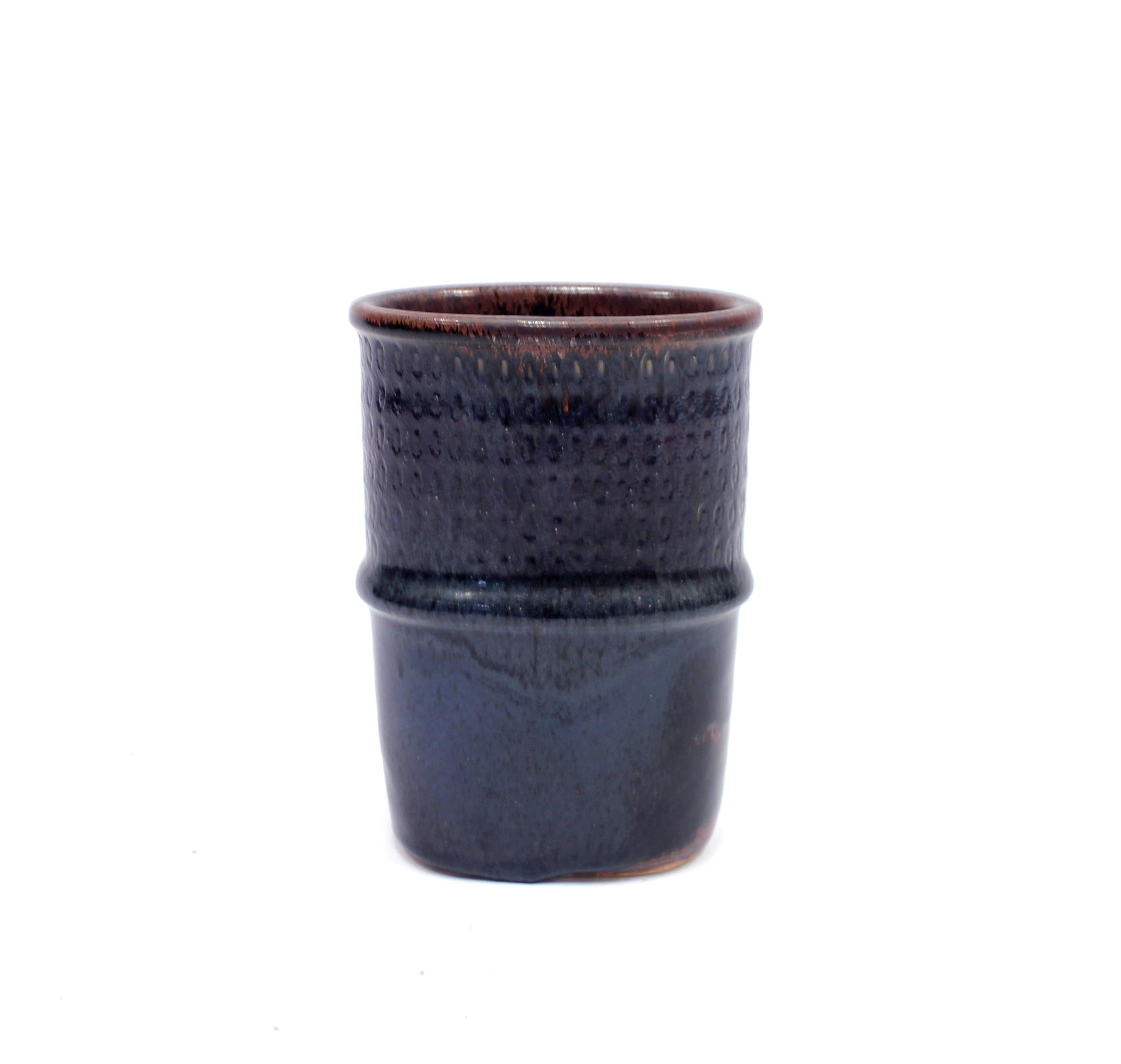 Blue/purple vase by renowned Swedish ceramicist Stig Lindberg for his long time collaborator Gustavsberg. Inside with brown/black finish. Made in the 1950s. Very good condition with light ware consistent with age and use. Hand signed on the bottom.