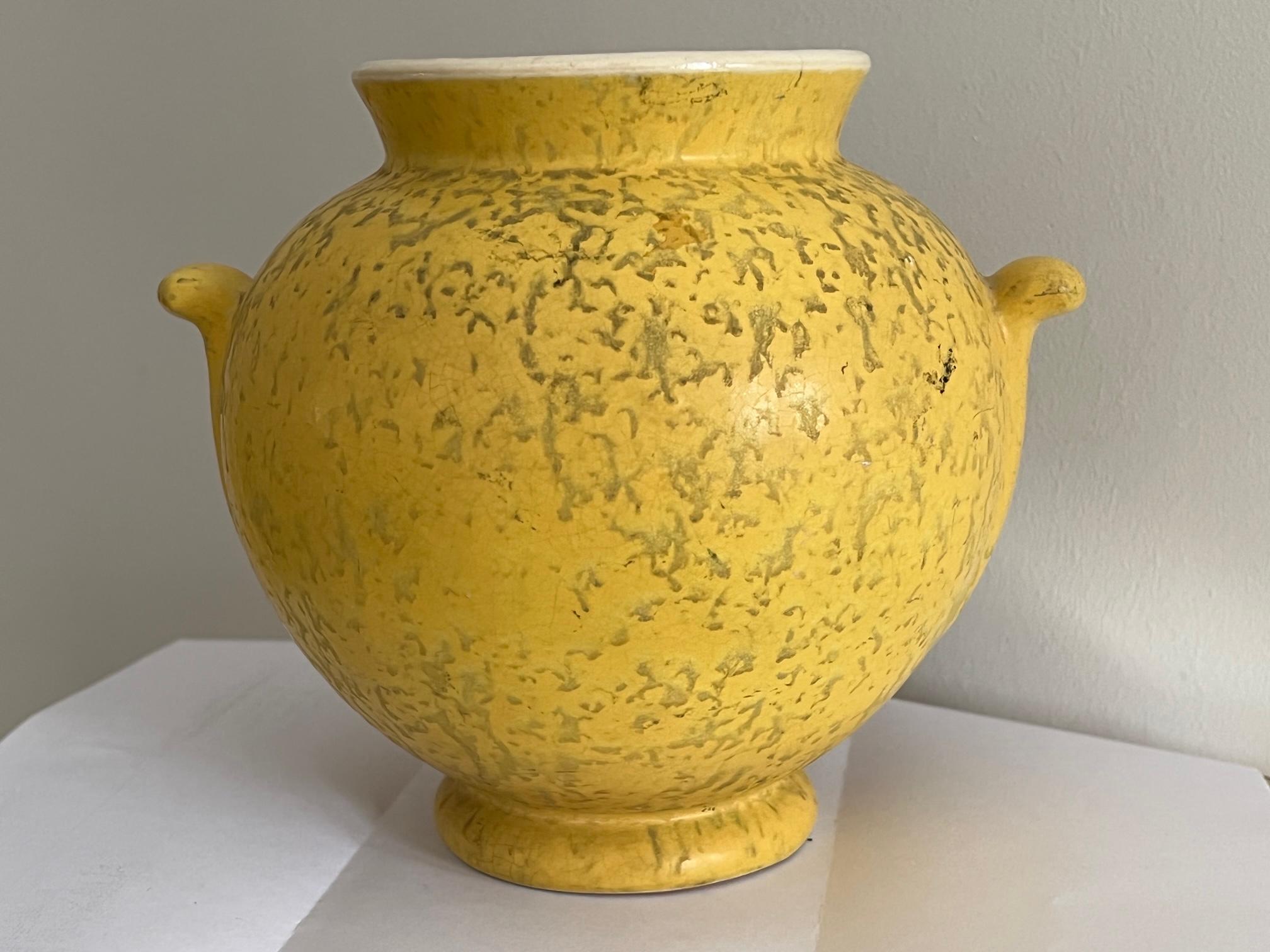 A charming ceramic pot by Weller, signed on the bottom, with handles. Beautiful decoration and yellow glaze.