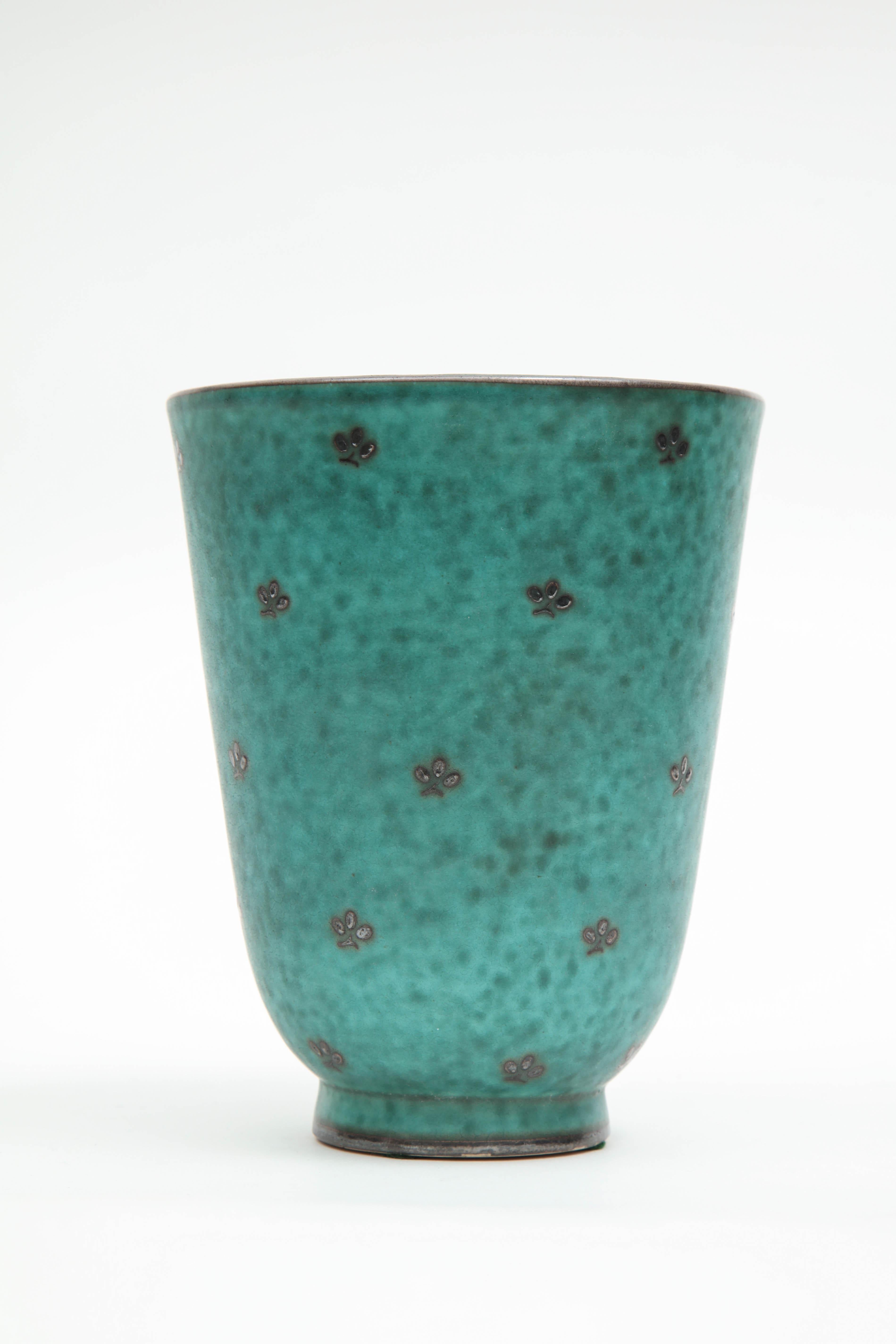 Ceramic vase by William Kage, Sweden, circa 1930. The item is from a group called Argenta because of the silver inlay.
