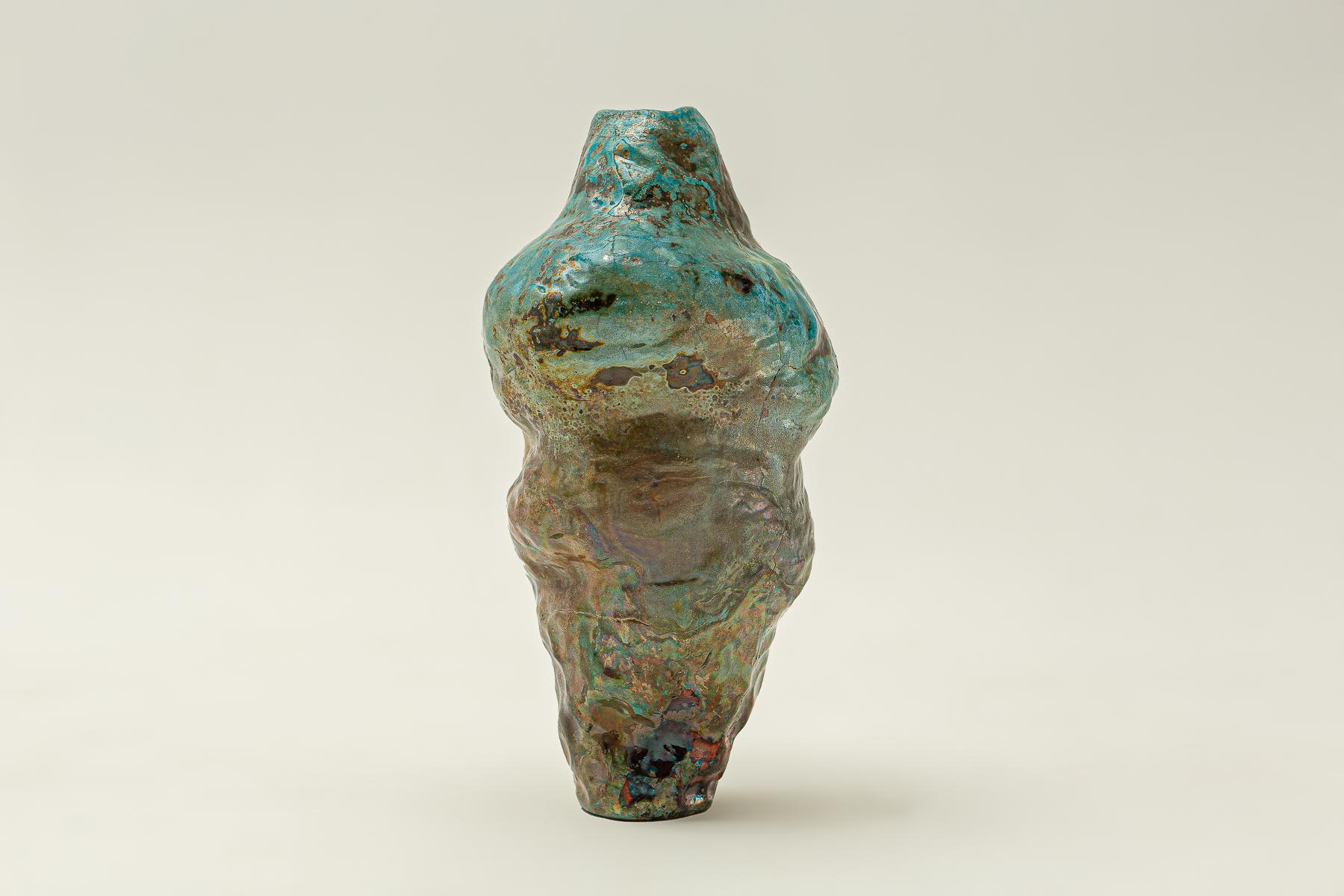 Hand formed, raku-fired stoneware vase. 
Dried flowers only. Raku ware is for decorative use only, and will not hold water.
Artist's signature on the bottom of the vase.
