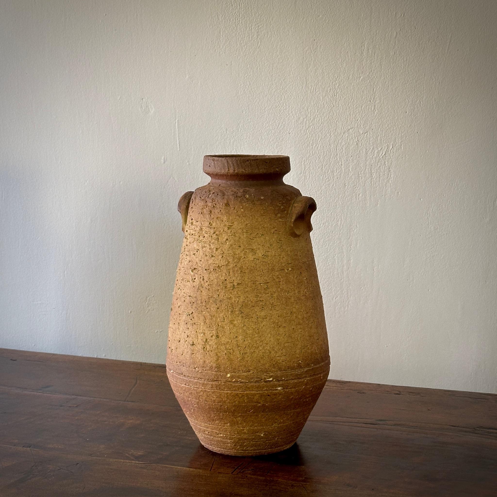 1960s earth-toned glazed ceramic vessel. With a textural finish, this vessel is defined by a refined rusticity.

France, circa 1960

Dimensions: 9.5W x 9.5D 17.5H