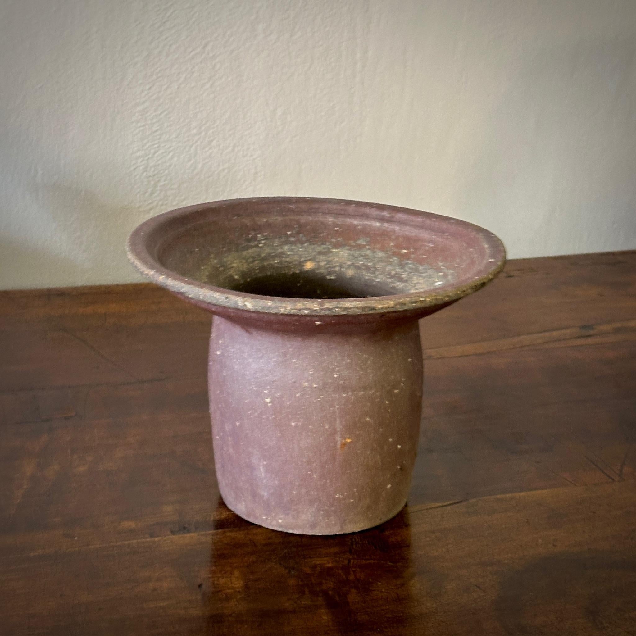 A Belgian glazed studio pot ceramic vessel or vase with an extended rim in terra cotta toned glazes. Functional on its own or as a statement displayed in a group with our collection of pottery vessels

Belgium, circa 1970

Dimensions: 10W x10D x 7.5H