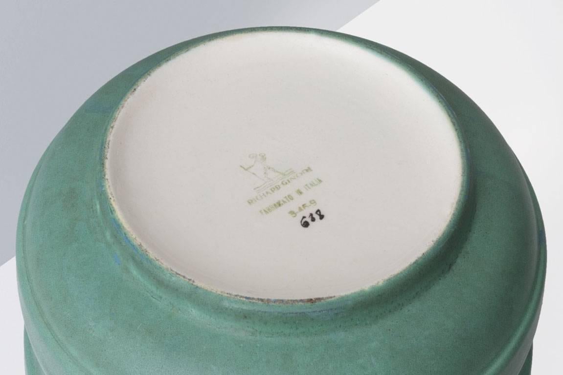 Gio Ponti (1891-1979).

Ceramic vase
Manufactured by Richard Ginori 
Italy, 1931.
Modelled ceramic and enameled in opaque green.

Measurements:
23 ø cm x 15 H cm.
7,87 ø inches x 5,12 H inches.

Literature
Richard-Ginori, Ceramiche