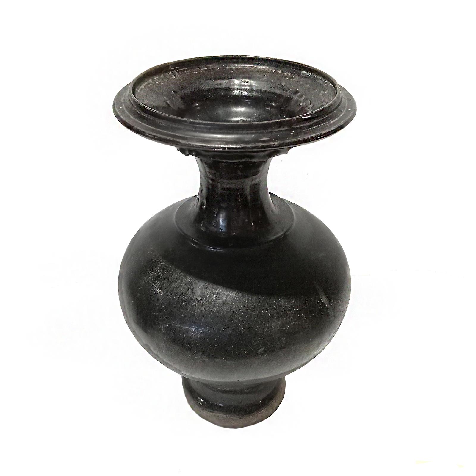 A Thai ceramic vase, glazed in black, early 20th Century. 

Natural clay / earthenware, same material originally used in ancient kilns of Sawankhalok, one of the two main centers of old Thai ceramics. 

Narrow neck with a wide top, curved round body