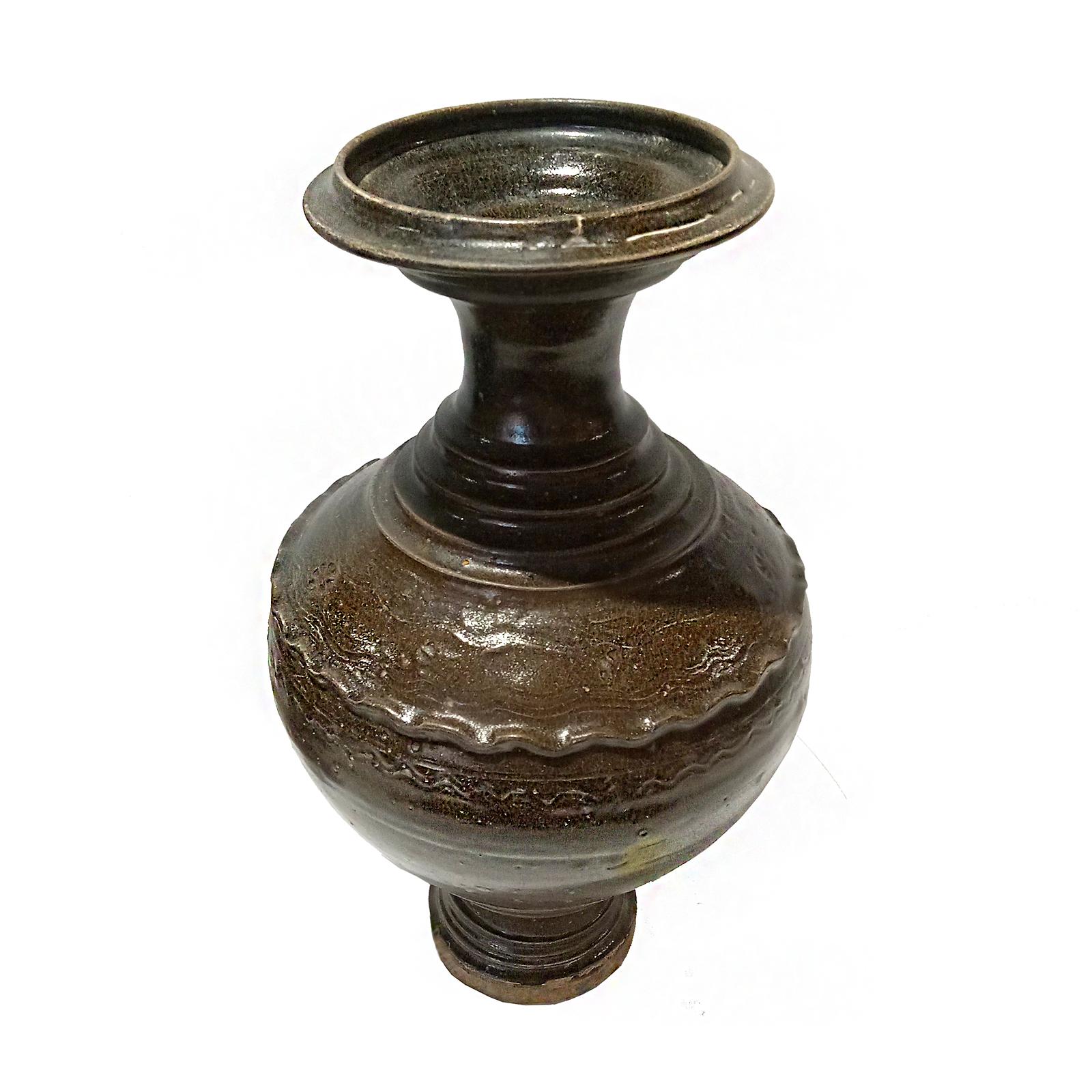 A Thai ceramic vase, glazed in black, early 20th Century. Natural clay / earthenware, same material originally used in ancient kilns of Sawankhalok, one of the two main centers of old Thai ceramics. 

Narrow neck with a wide top, curved round body