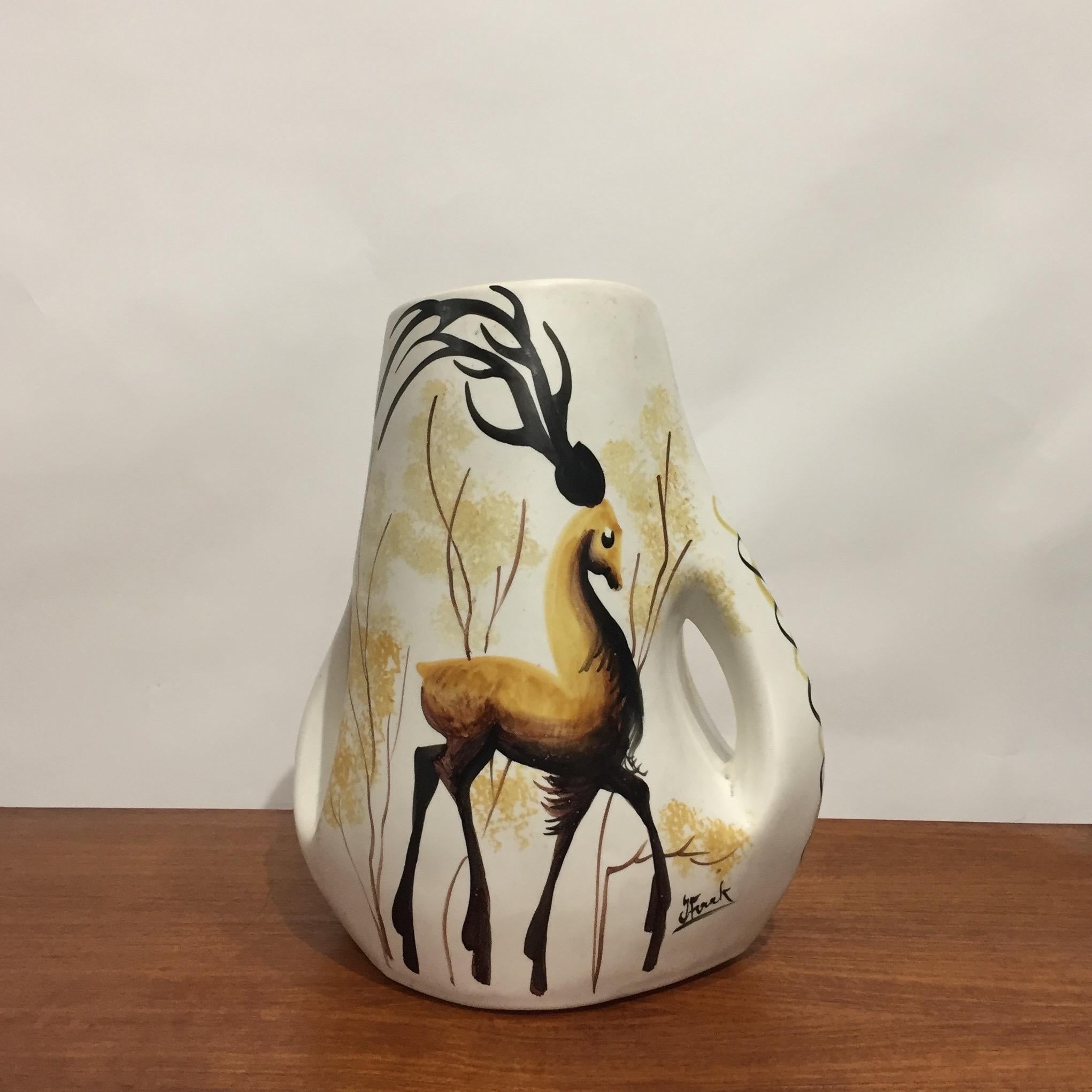 1960's French Vallauris ceramic vase.
White and Yellow with a painted deer decoration. 
Two large Handles. Signature of Vallauris under the base. 
Rare model with a beautiful quality of work.