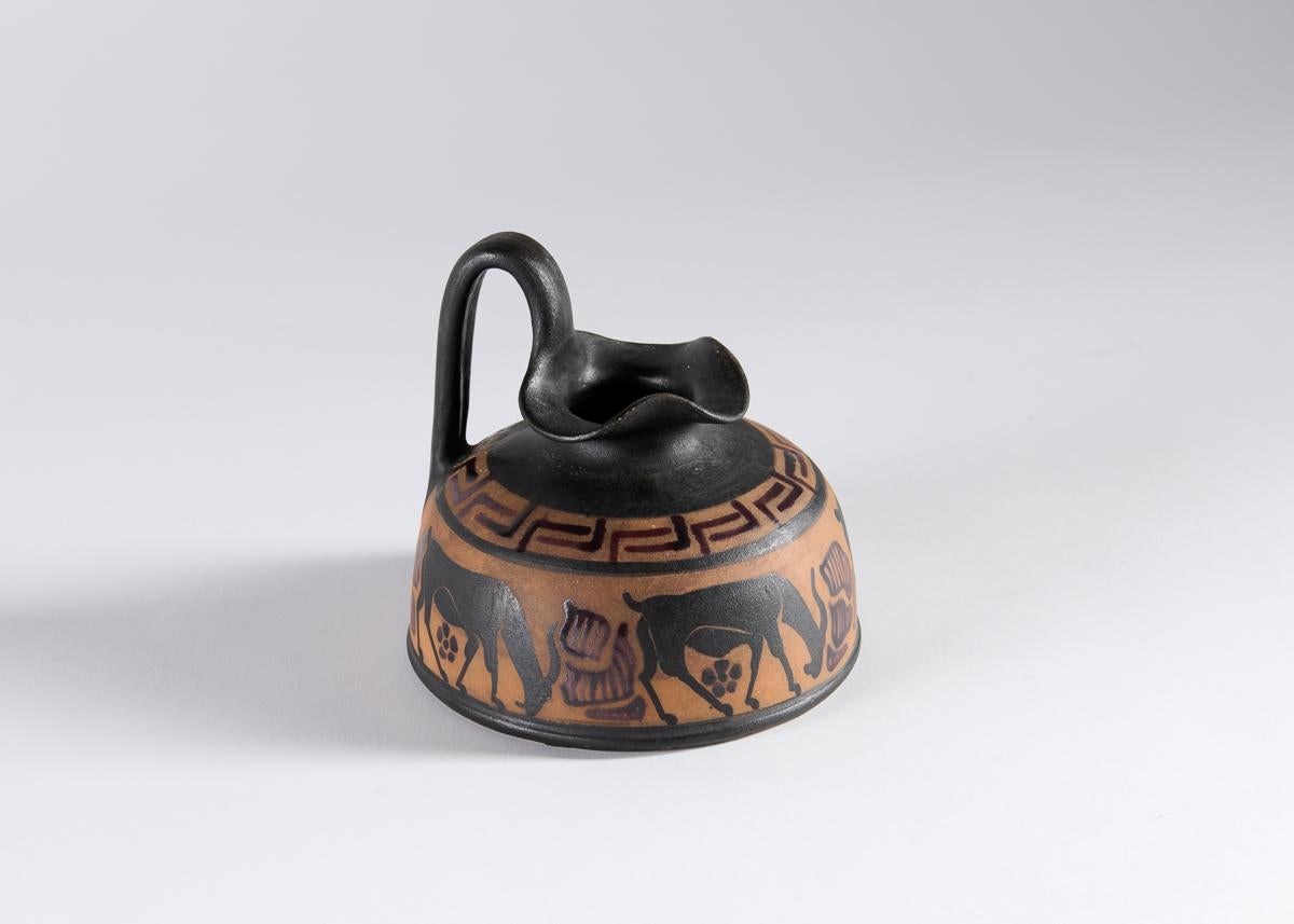 One of a set of beautiful ceramics from Ciboure Pottery, this vase is inspired by antiquity—evident in its form, its spare coloring, and its stylized depiction of animals.