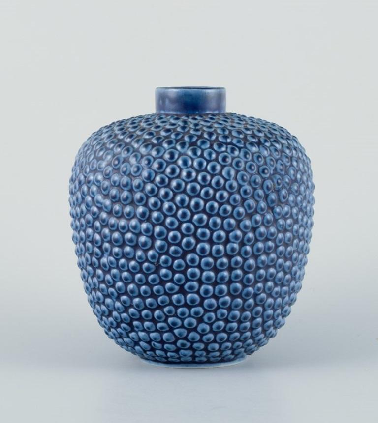 Ceramic vase in modernist design with blue glaze.
From around the 1970s.
Marked with model number at the base.
In excellent condition with a minor chip at the top of the vase. See photo.
Dimensions: Height 12.0 cm x Diameter 10.0 cm.

