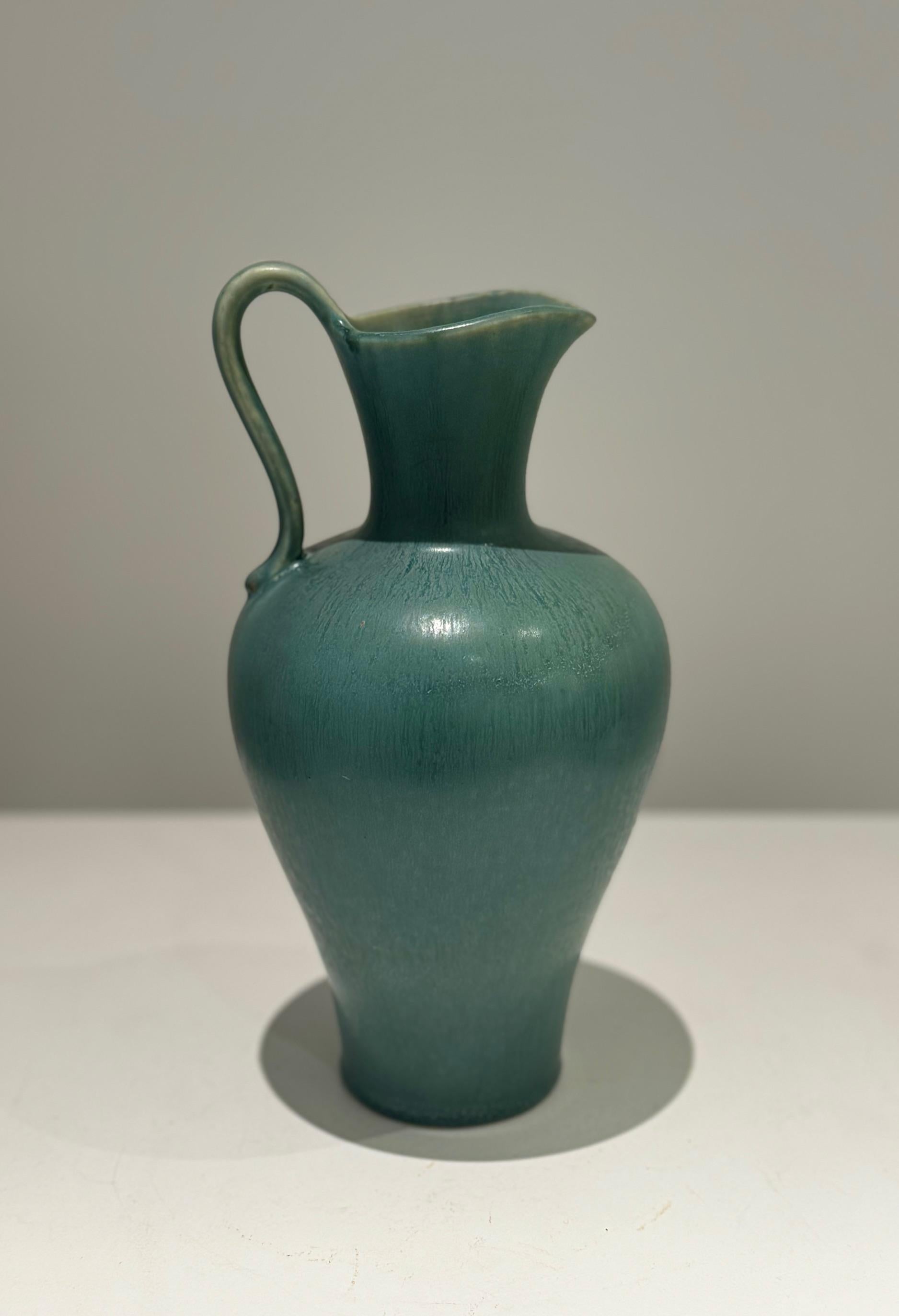 Scandinavian Midcentury Ceramic jug vase in har fur glaze green enamel
Signed on back with 