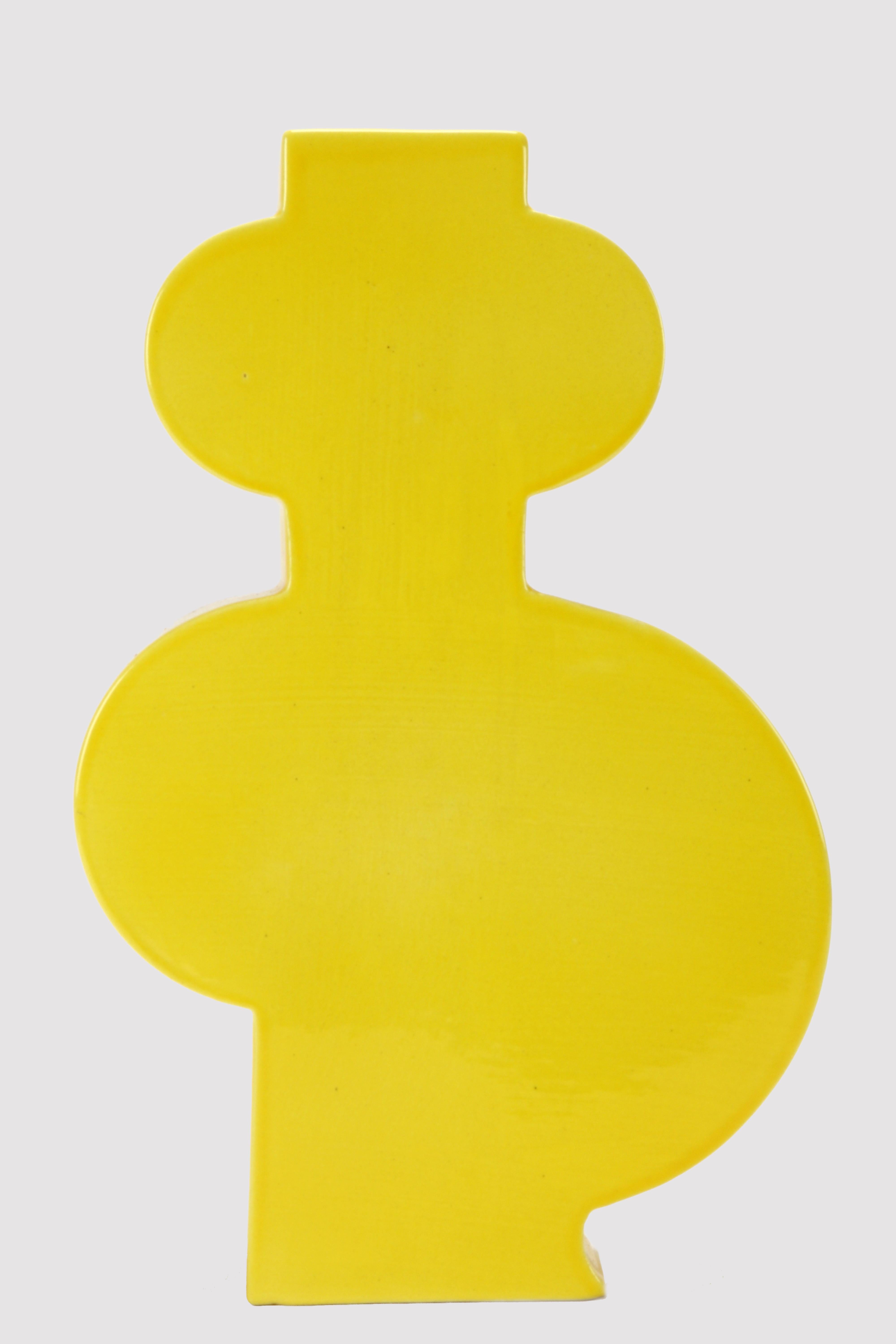 Painted ceramic vase Memphis Milano by Luciano Florio Paccagnella, Lola, yellow color.
He was an important member of the group when he created his series of unique handmade vases. Florio Paccagnella studied advertising graphics at the Liceo