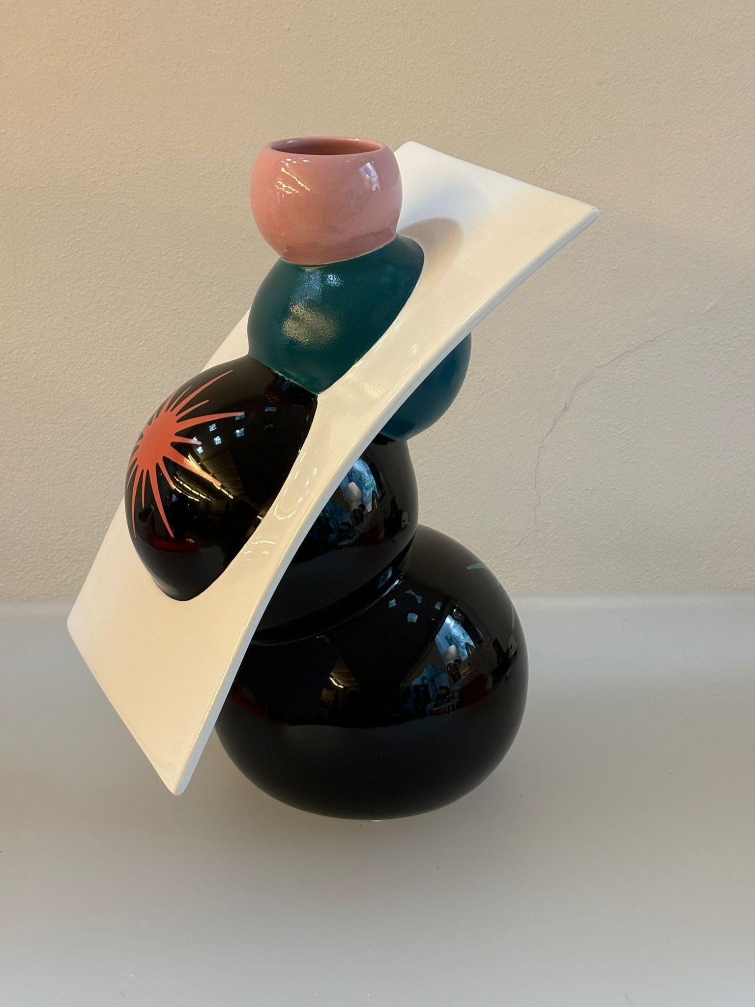 Vaso in ceramica modello C versione 2, collezione ABC, disegnato da Alessandro Mendini e prodotto da Superego Editions. Edizione limitata a 29 pezzi. Firmato e numerato.

Biografia
Alessandro Mendini è nato a Milano nel 1931. Dopo una lunga
