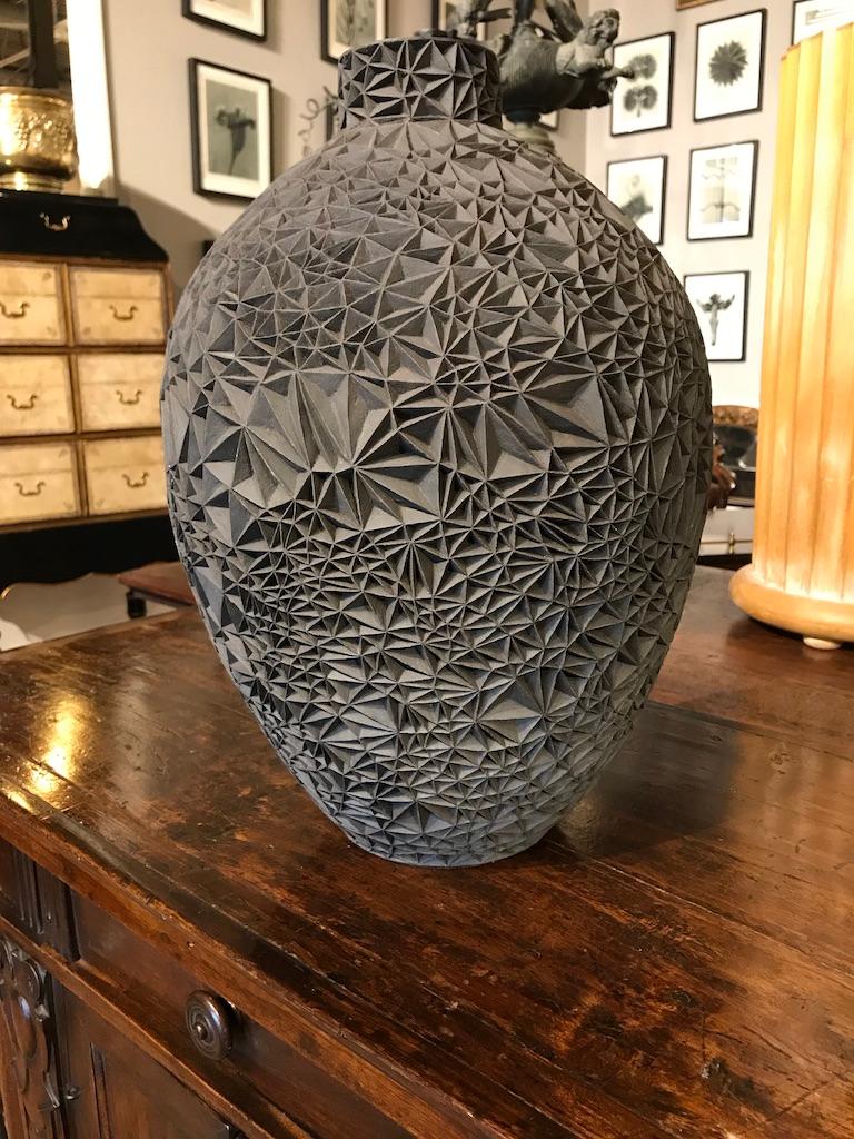 This wonderful piece combines the contemporary modern with the Italian Renaissance. Based on the 15th century painting, ‘Primavera’ by Sandro Botticelli, this black stoneware vessel has a carved, faceted exterior. A true work of art, more a piece of