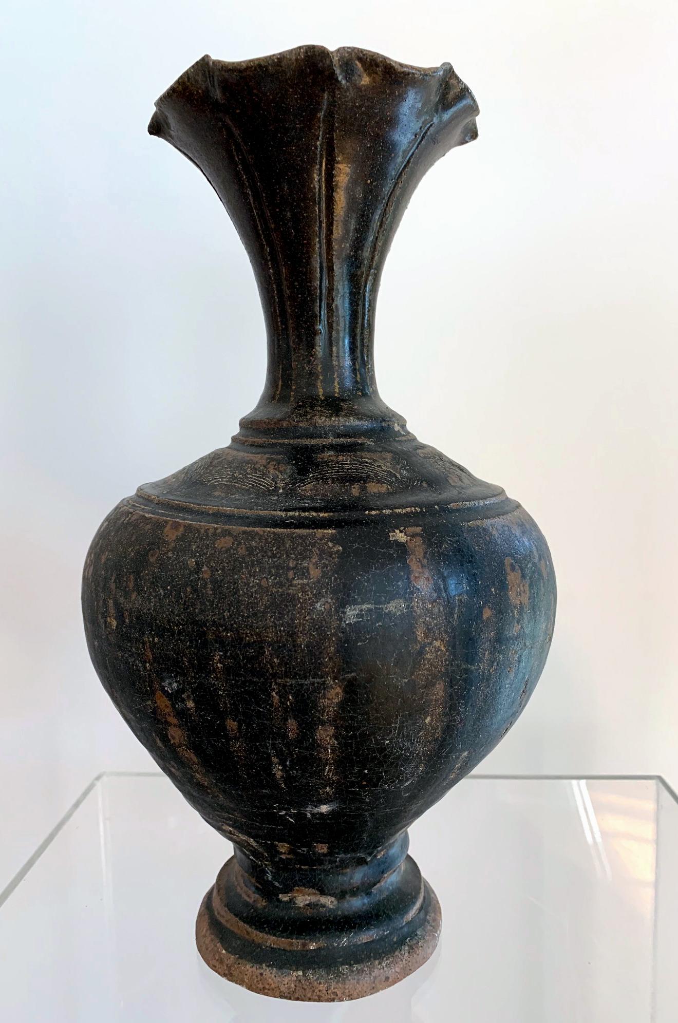 Ceramic vase with black glaze Khmer Angkor Period On offer is a stoneware ceramic vase with black iron glaze from Khmer Kingdom (now Cambodia) dated to Angkor period circa 12th century. The vase is constructed in a very elegant form derived from
