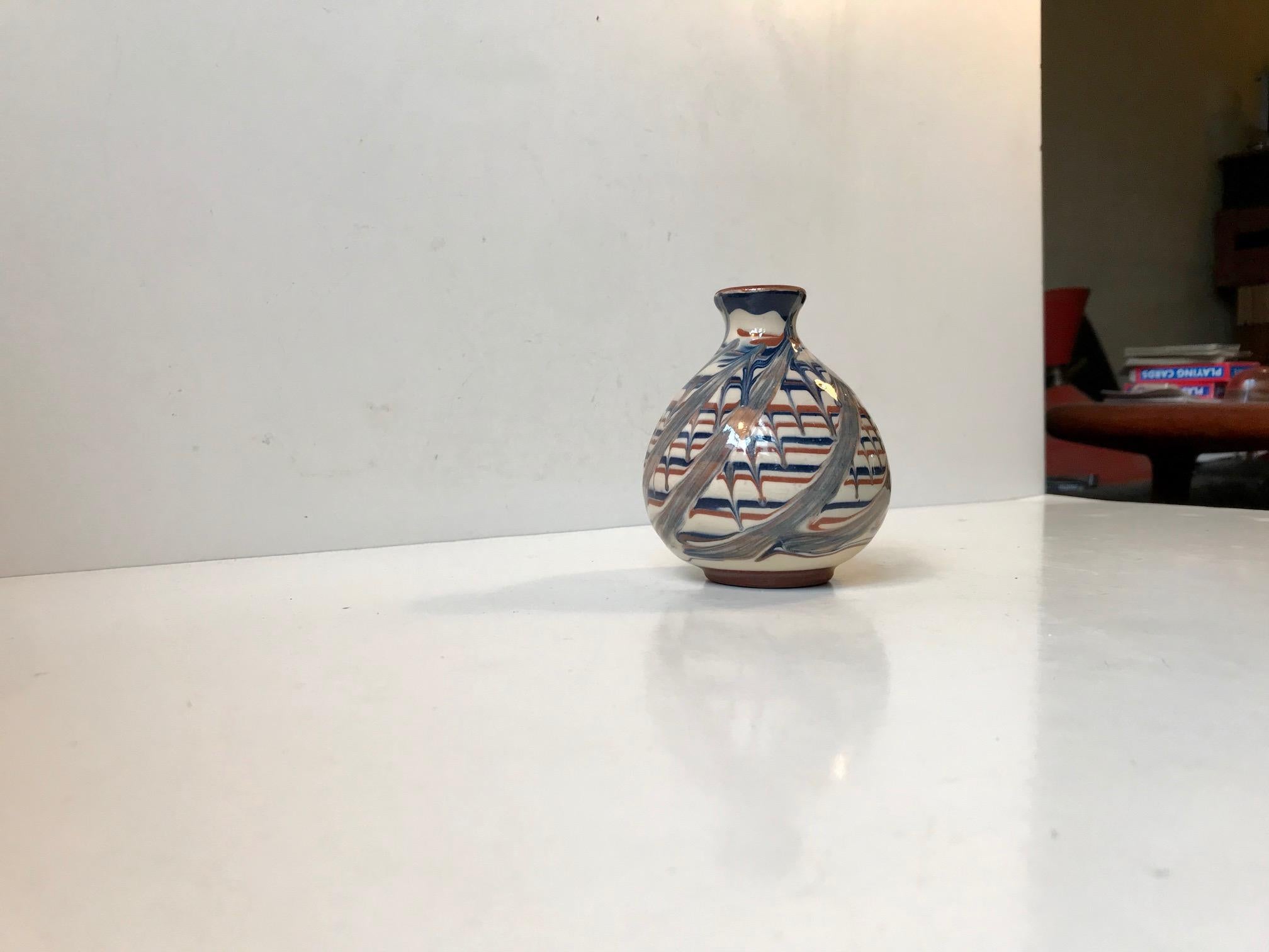 Small unusual vase in earthenware. It features molested/deconstructed glaze. It is signed JB. However this ceramist has not been identified. Its not Jacob Bang nor Jens Bohr.