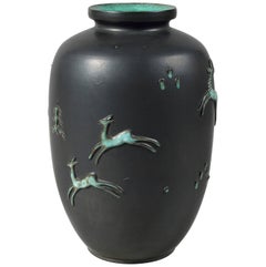 Ceramic vase with green and black enamels