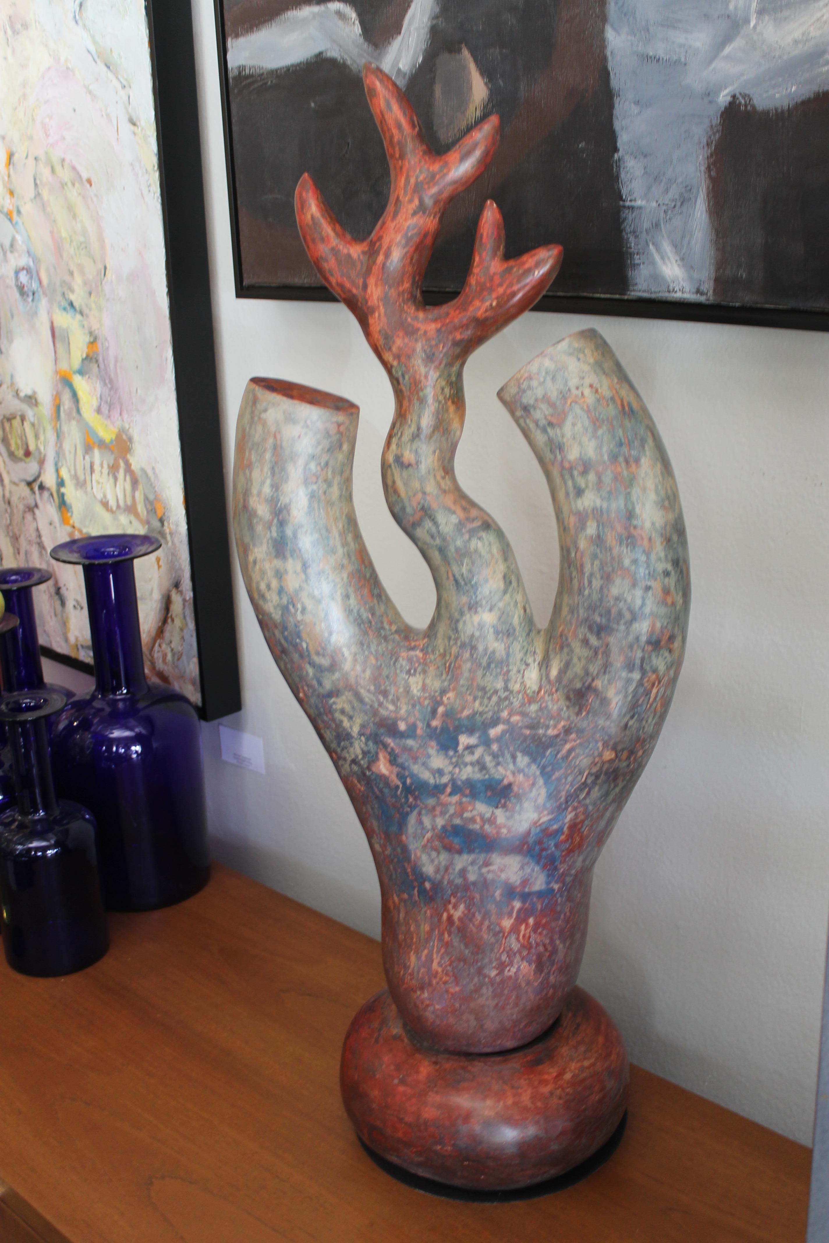 Ceramic sculpture with a snake motif by James Kouretas (1947-2016). Sculpture measures 14