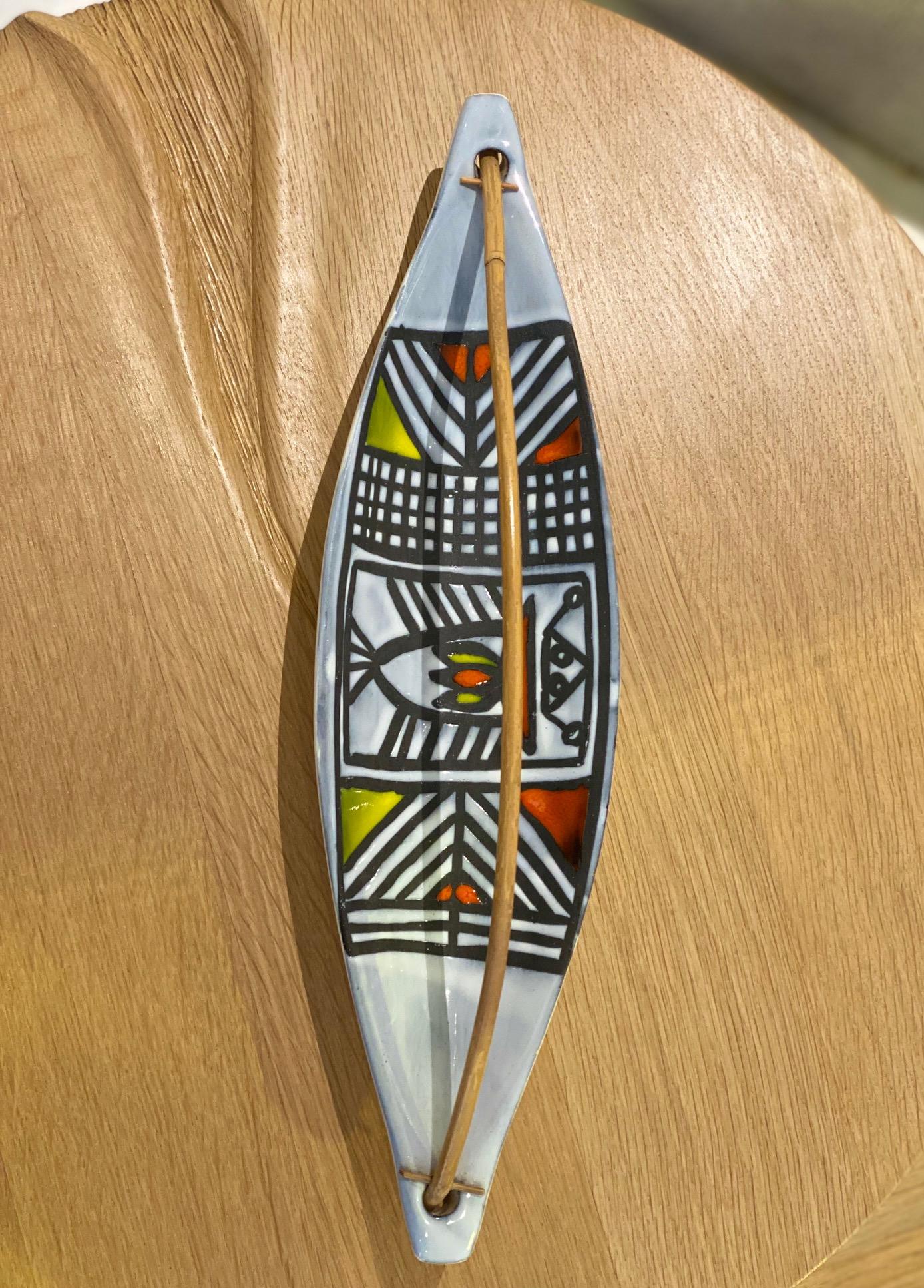 Roger Capron (1922-2006)
Stylized vide poches / cup with a fish on geometric enameled decor and bamboo handle 
signed Capron Vallauris circa 1950
Measures: H 10 cm (with handle) x L 38 cm.