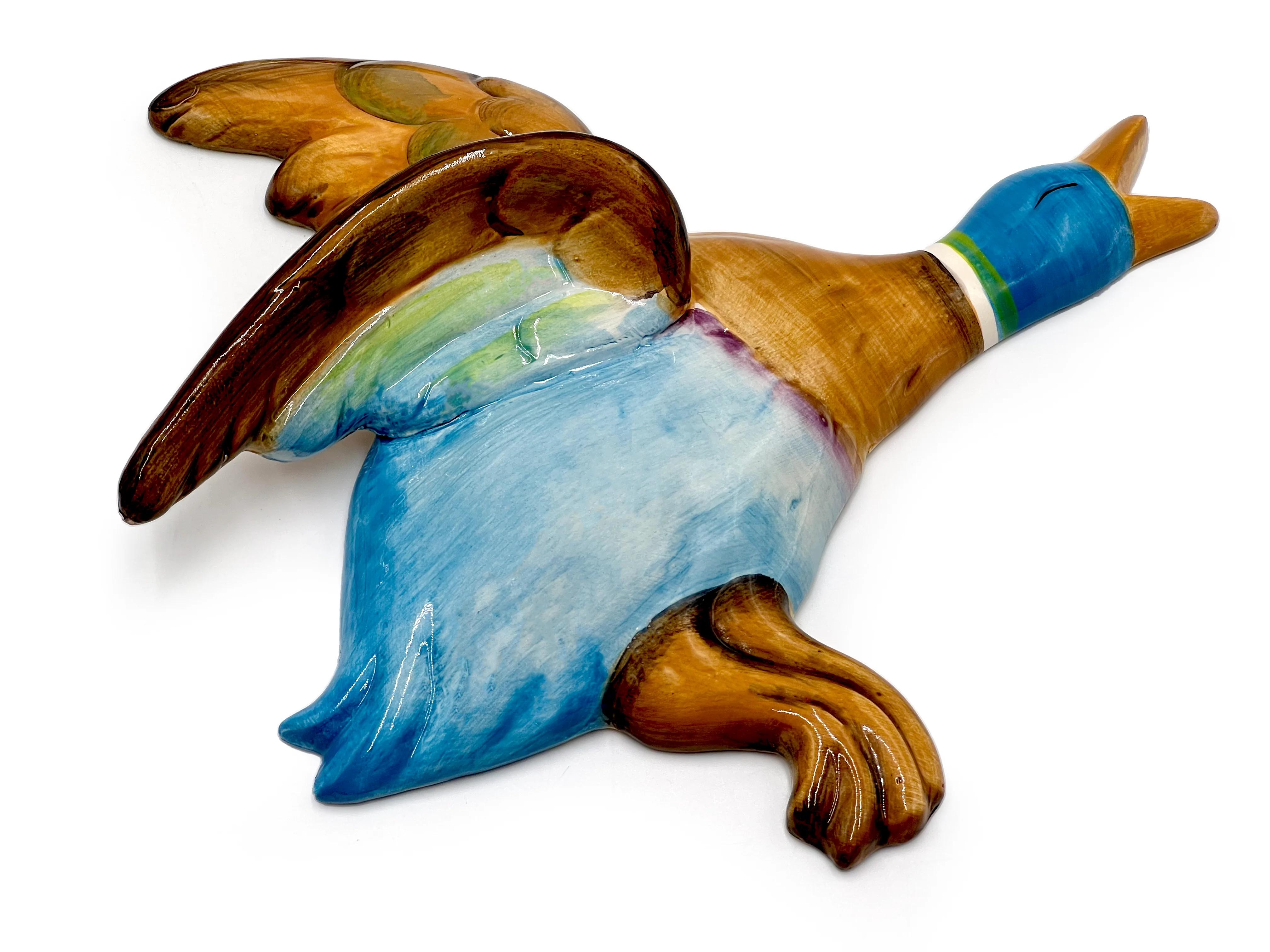 An incredible set of four vintage 1940s/50s ceramic flying ducks, made in England.

All are in excellent condition with no wear to mention. The colours are bright and shiny and they are free from any chips or cracks. Each is stamped ENGLAND on the