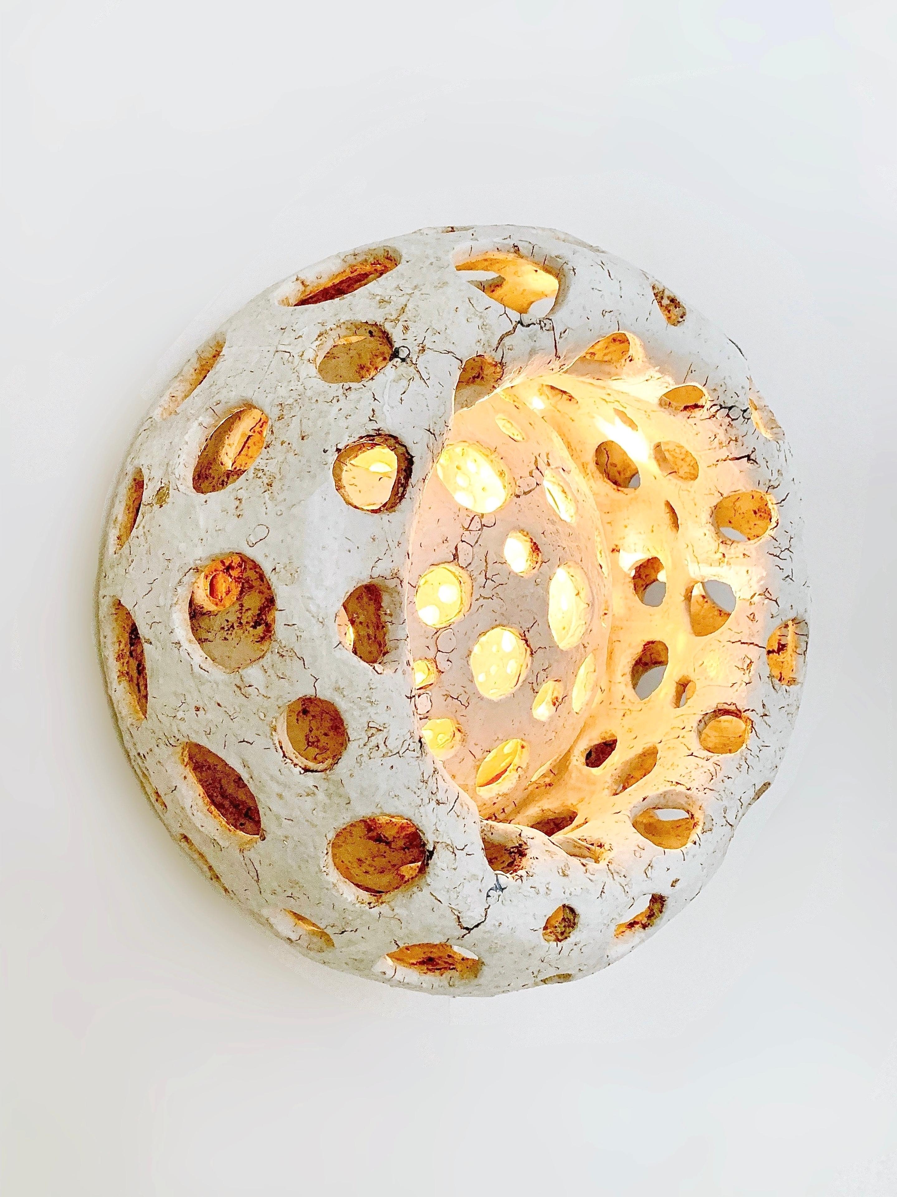 “Baba” wall lights by Agnès Debizet, 2020
______
Pair of light openwork wall lights in sandstone and porcelain engobe, mosaic elements. Unique pieces, signed.
______
Dimensions: Ø 38cm
______
Born in Marseille, Agnès Debizet first started