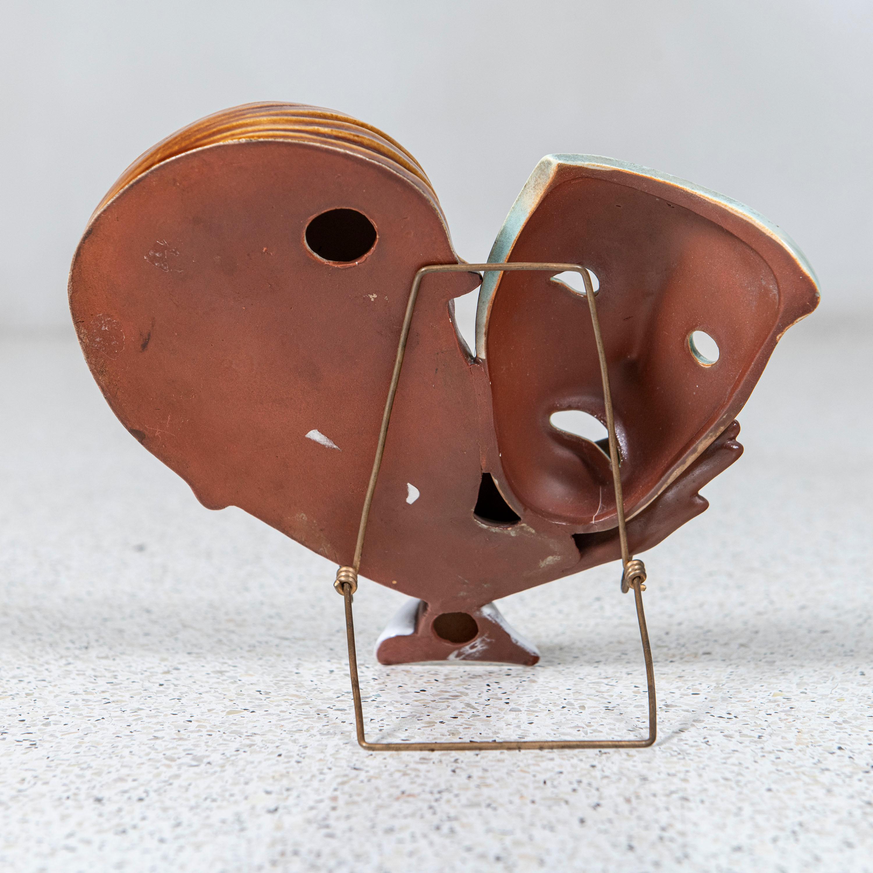 maschere in ceramica da appendere