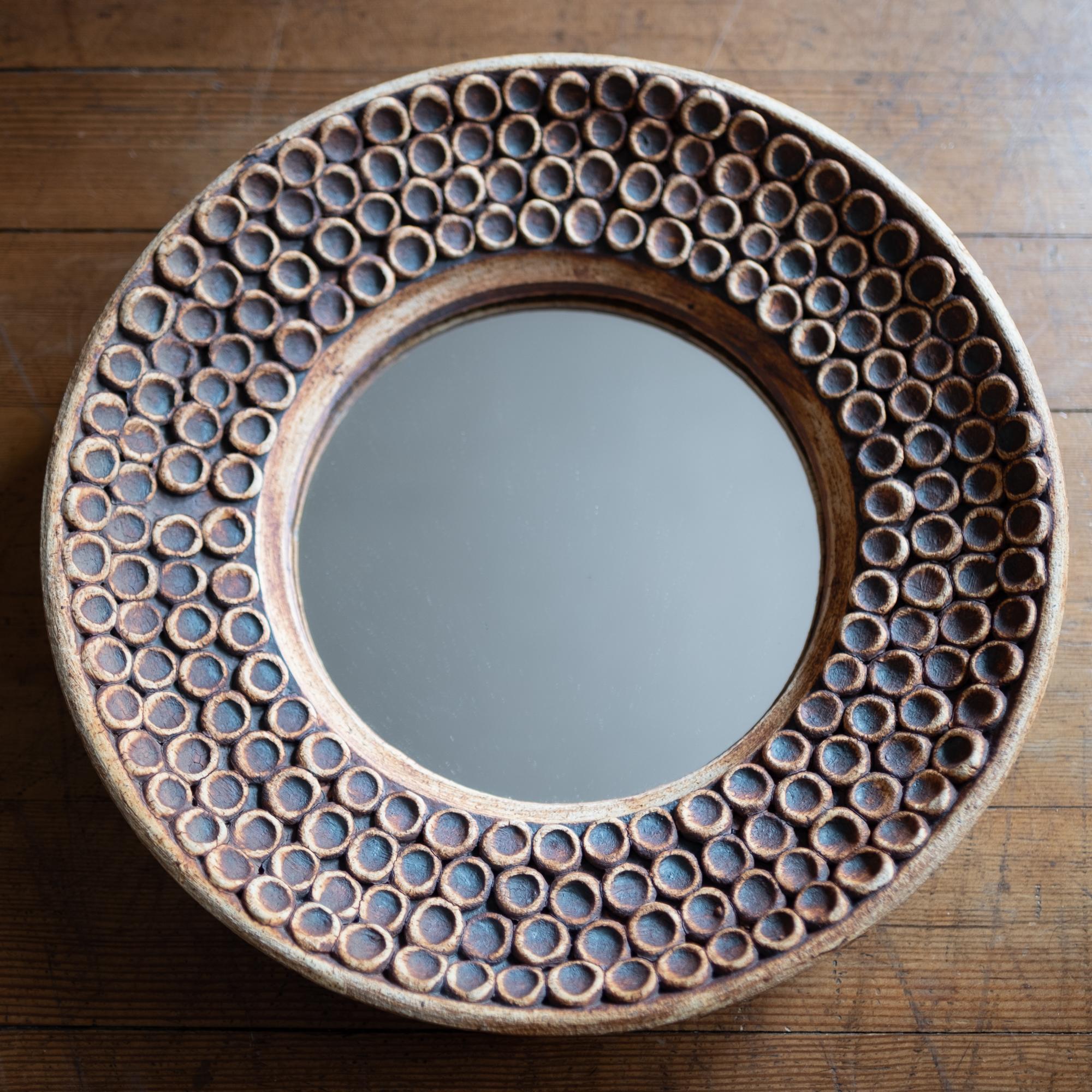 Ceramic wall mirror from the 1960s. Expertly crafted but unsigned.