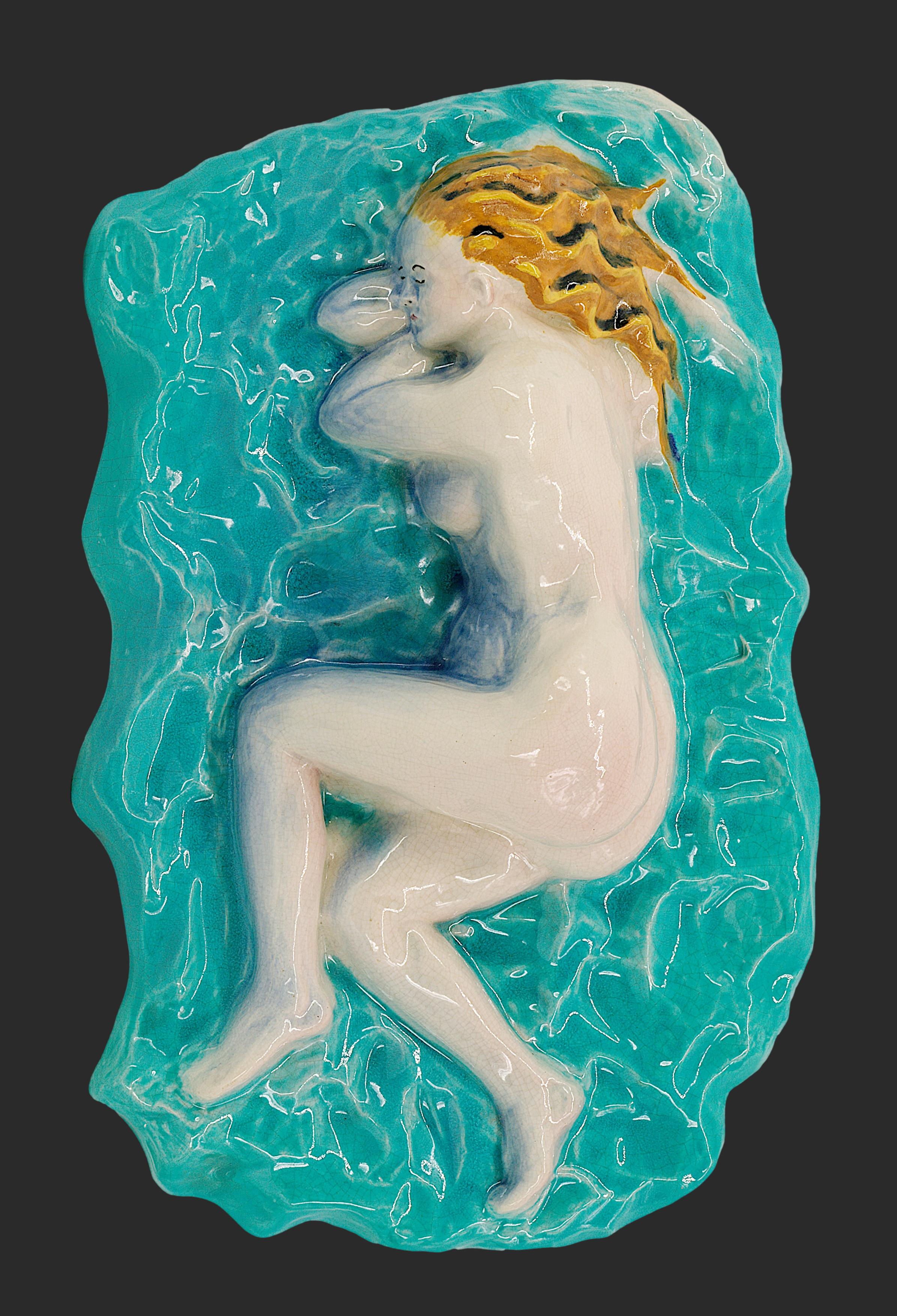 This stunning French Art Deco crackle glaze ceramic plaque, dating back to the 1920s, showcases the elegance and craftsmanship of the era. The plaque features a beautiful crackled glaze finish, characteristic of the Art Deco period, adding texture